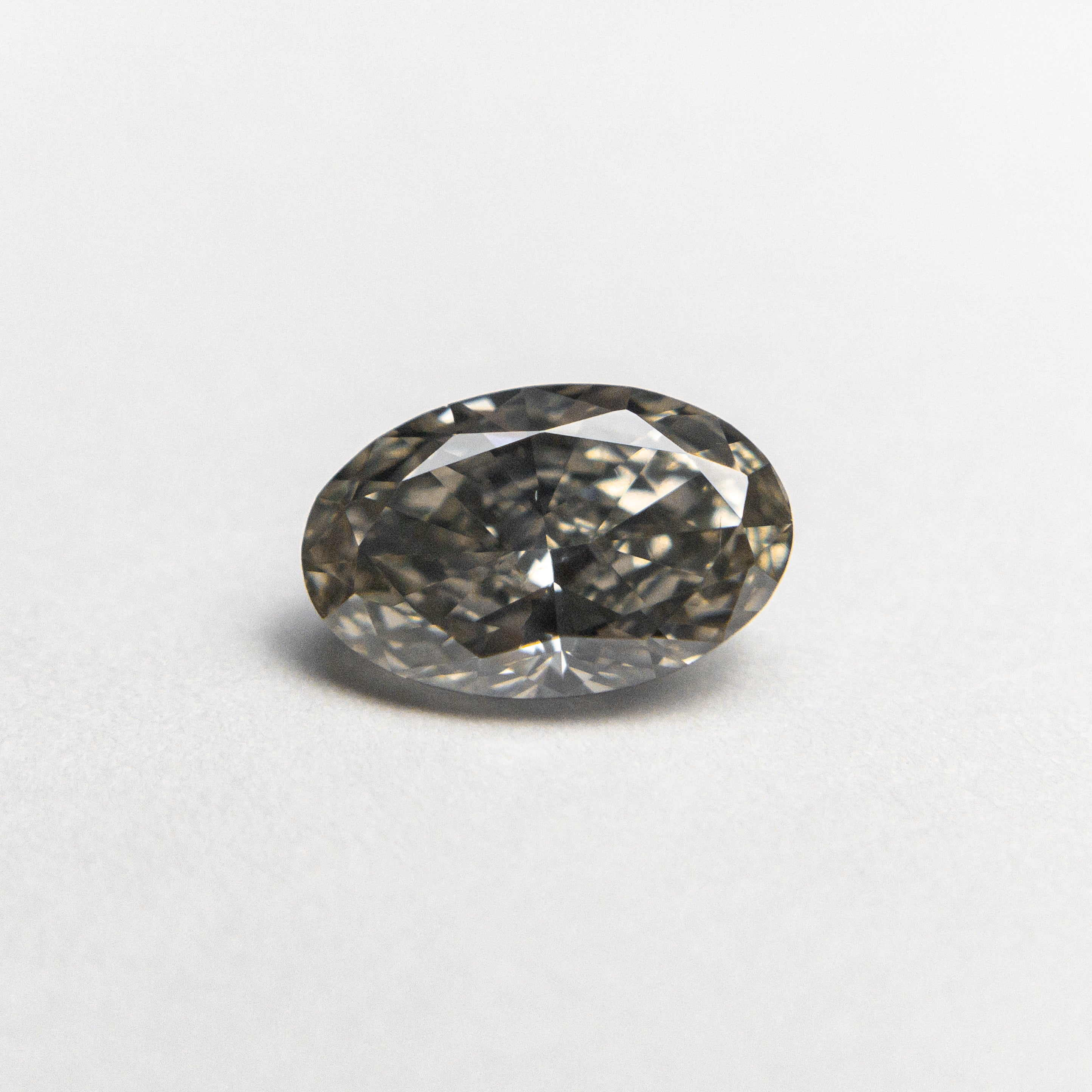 0.62ct 6.86x4.42x2.79mm SI1 Fancy Grey Oval Brilliant 19923-19