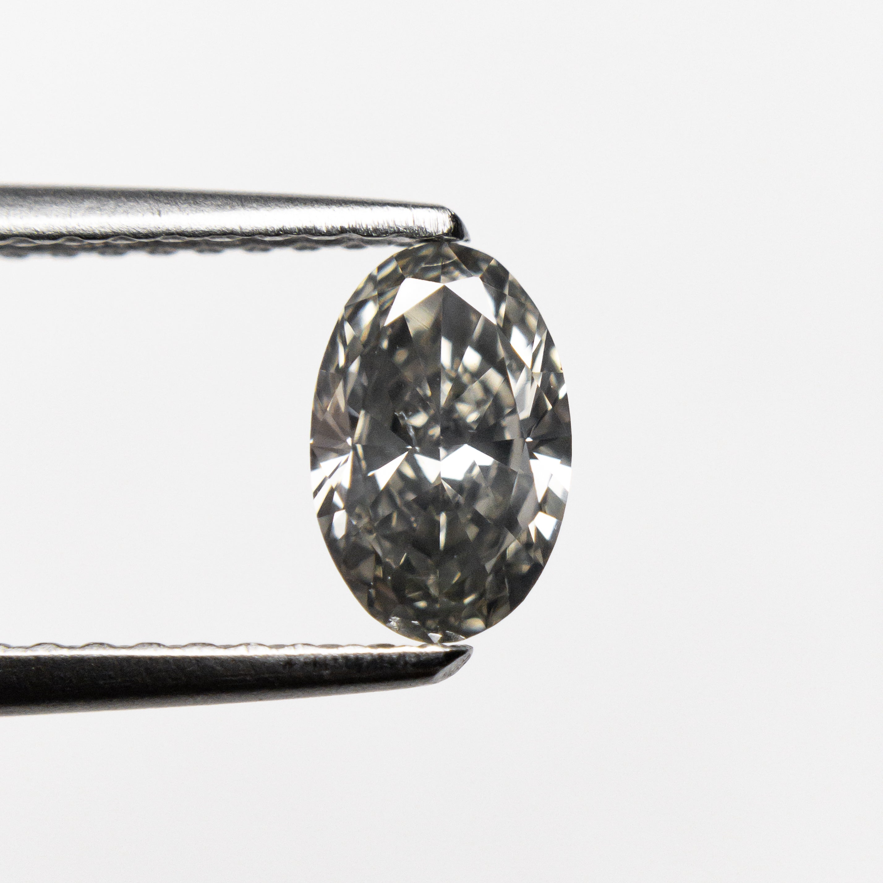 0.62ct 6.86x4.42x2.79mm SI1 Fancy Grey Oval Brilliant 19923-19