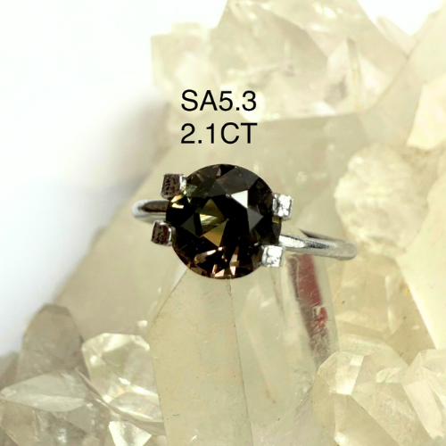Diamond ring with a brown SAPPHIRE gemstone on a white background