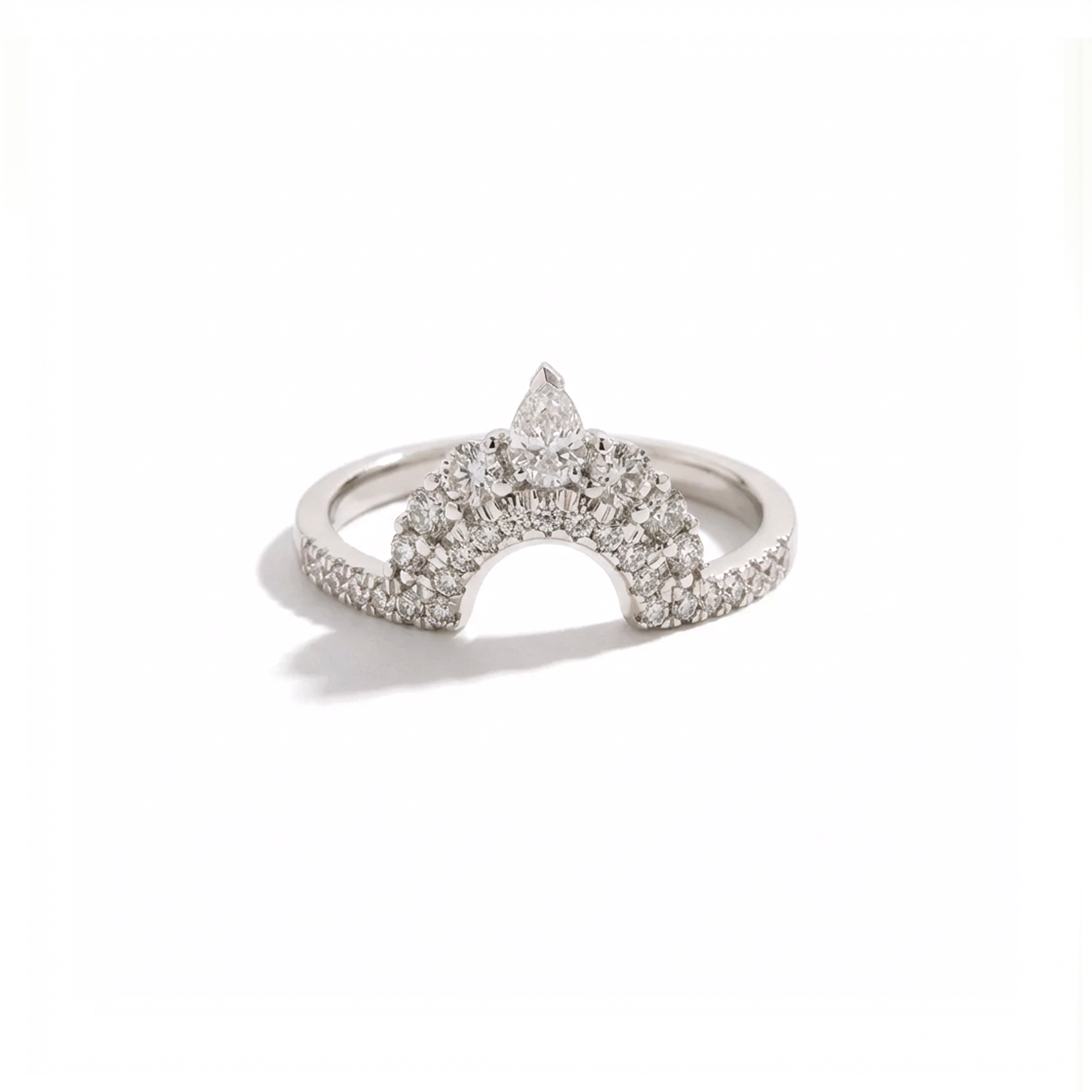 Silver ring with star-shaped diamond design on a white background