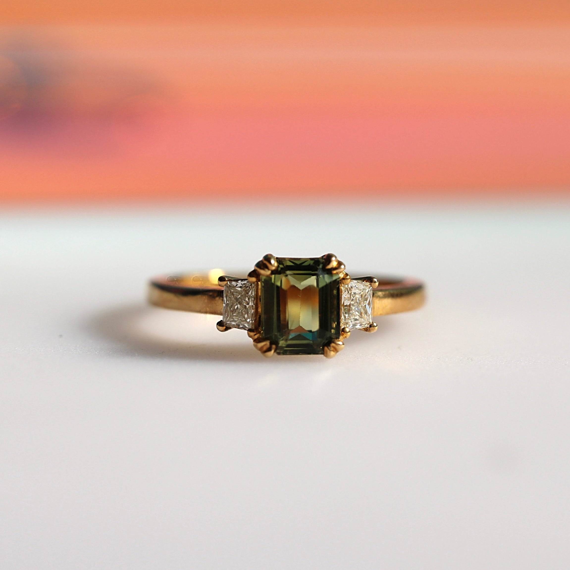 Art Deco inspired three-stone sapphire engagement ring in 9ct yellow gold