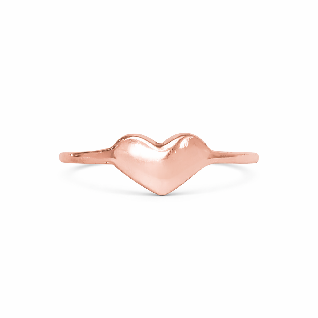 Rose gold heart-shaped ring on a white background