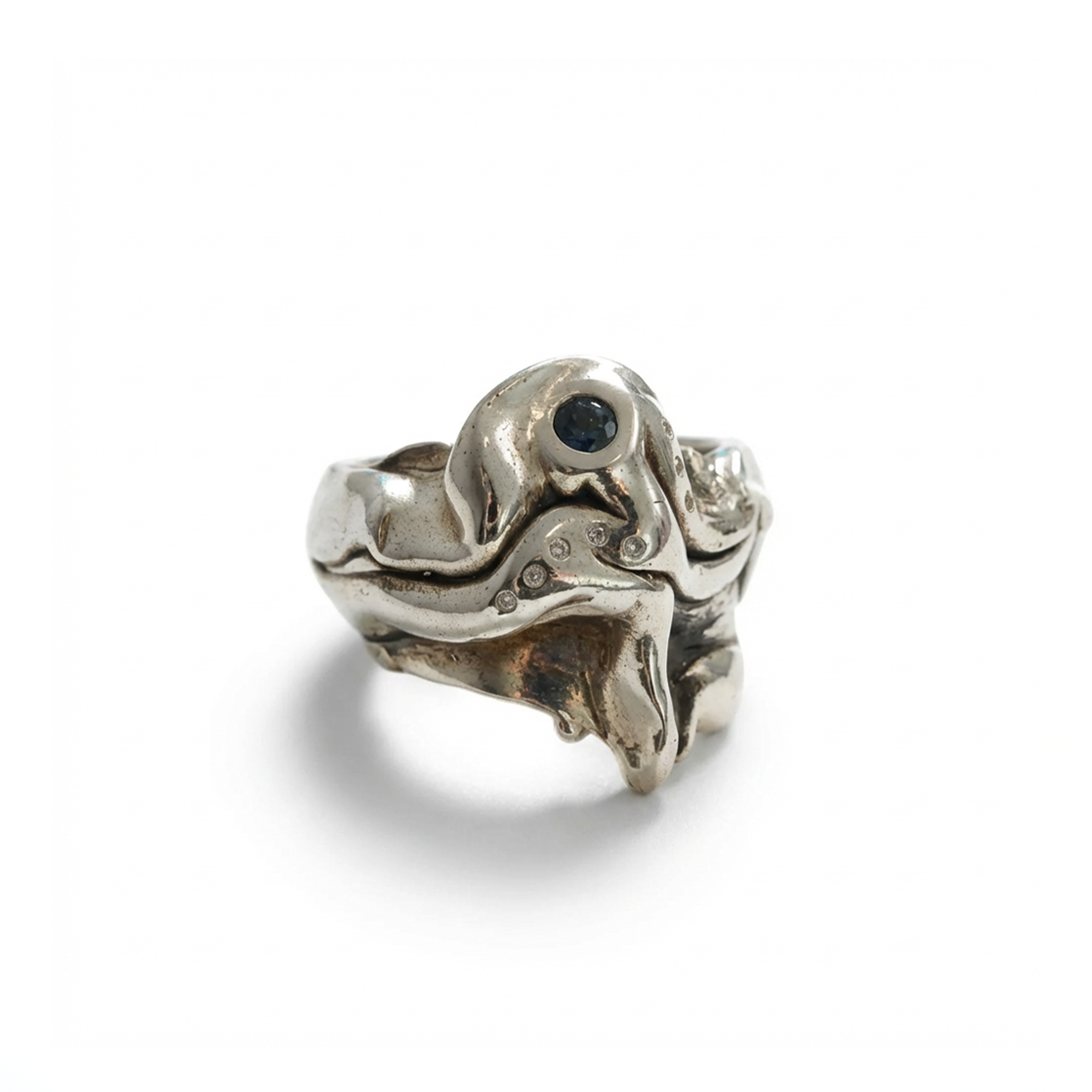 Silver ring with a black gemstone on a white background