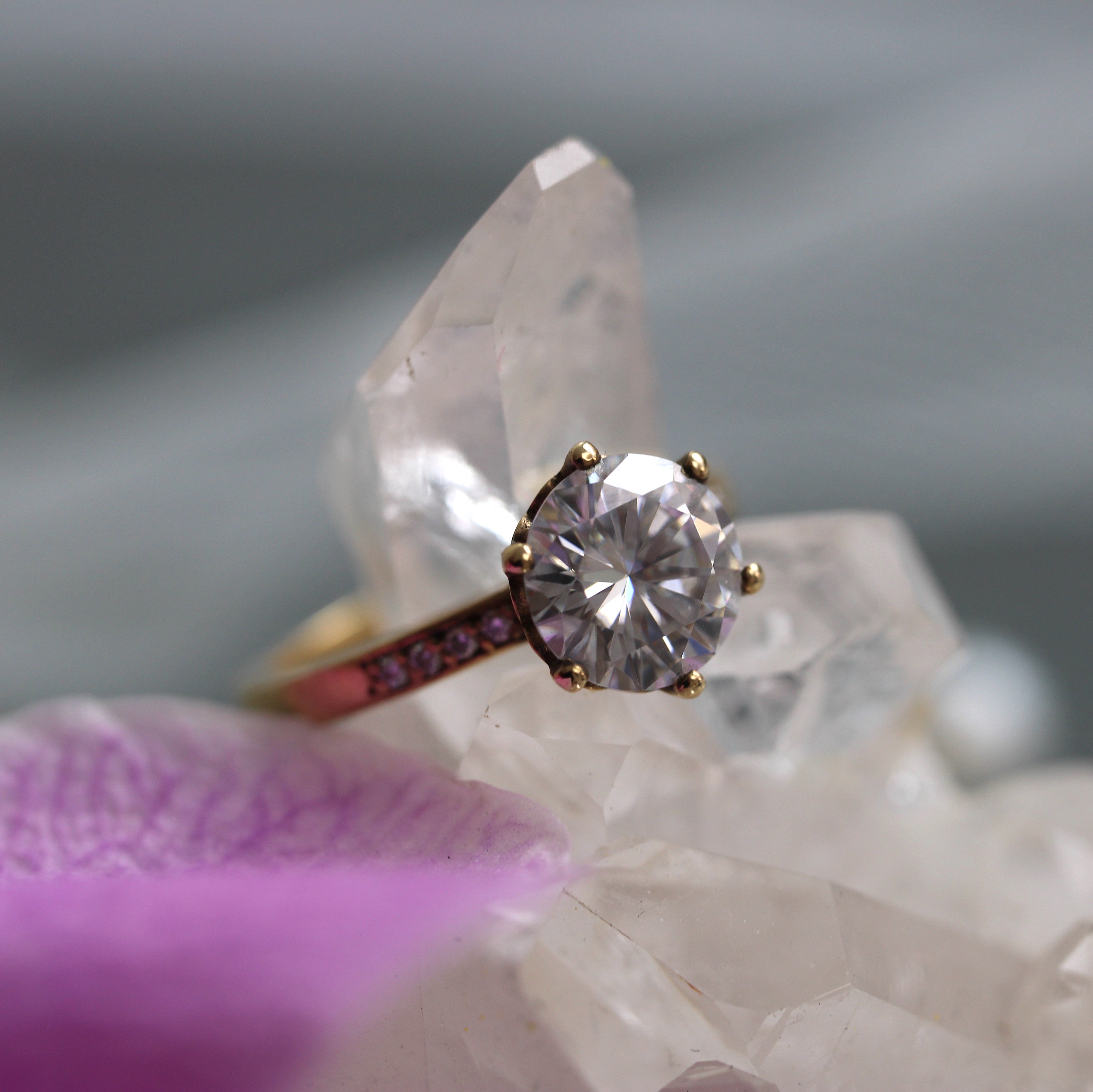 Round moissanite engagement ring in 9ct yellow gold with diamond accents