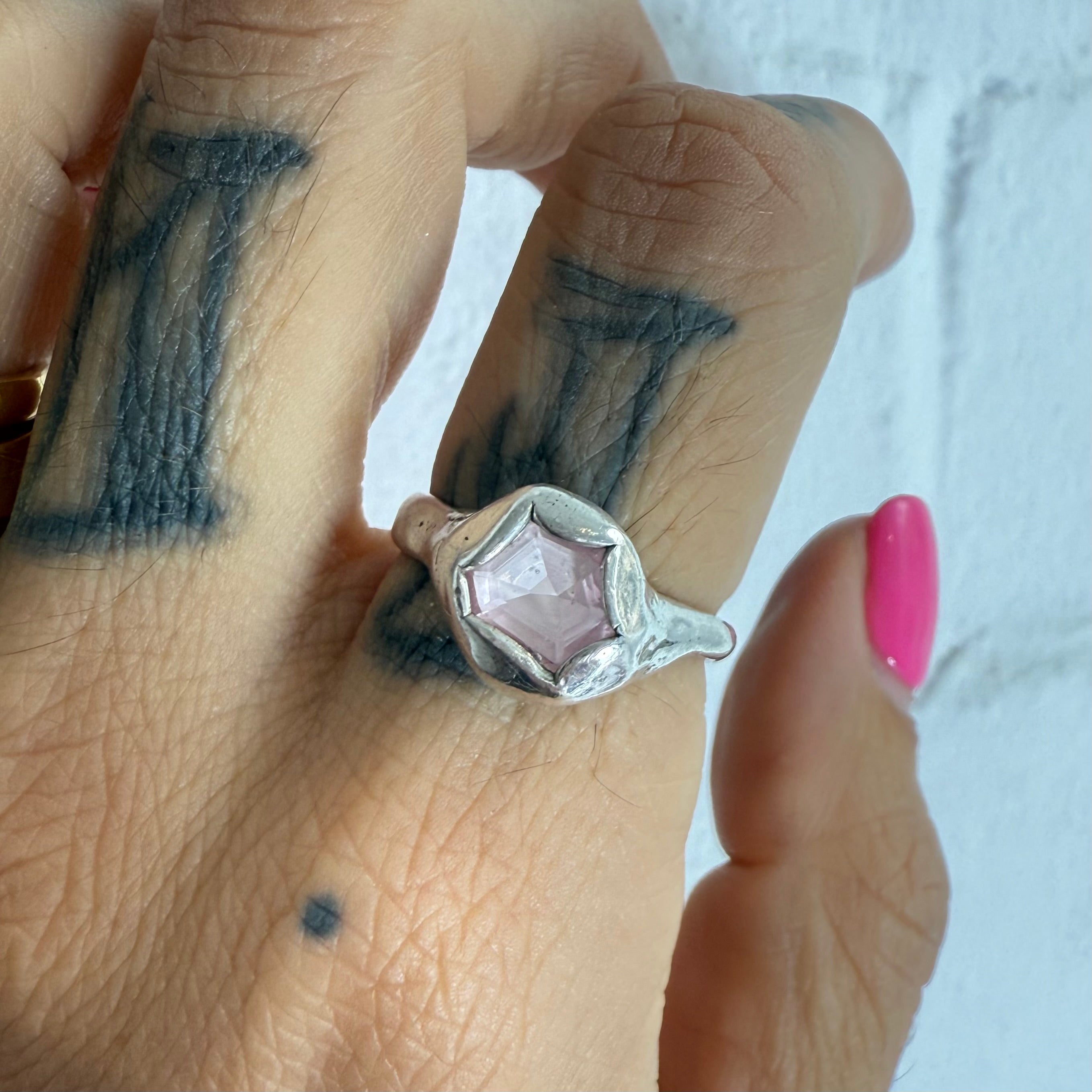 organic blob style ring with pink geometrical sapphire
