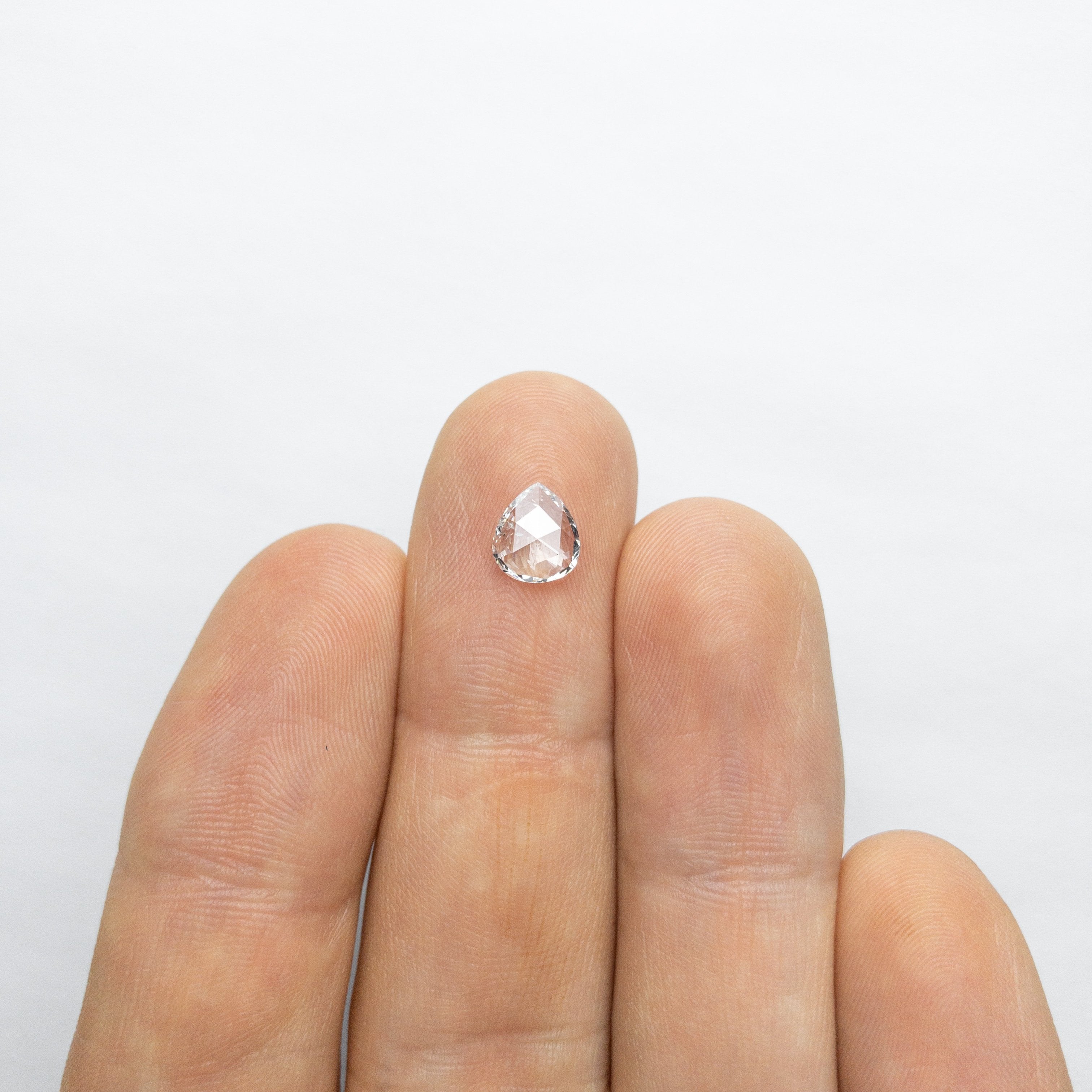 0.65ct 7.29x6.33x1.81mm Pear Rosecut 18050-03 hold d963