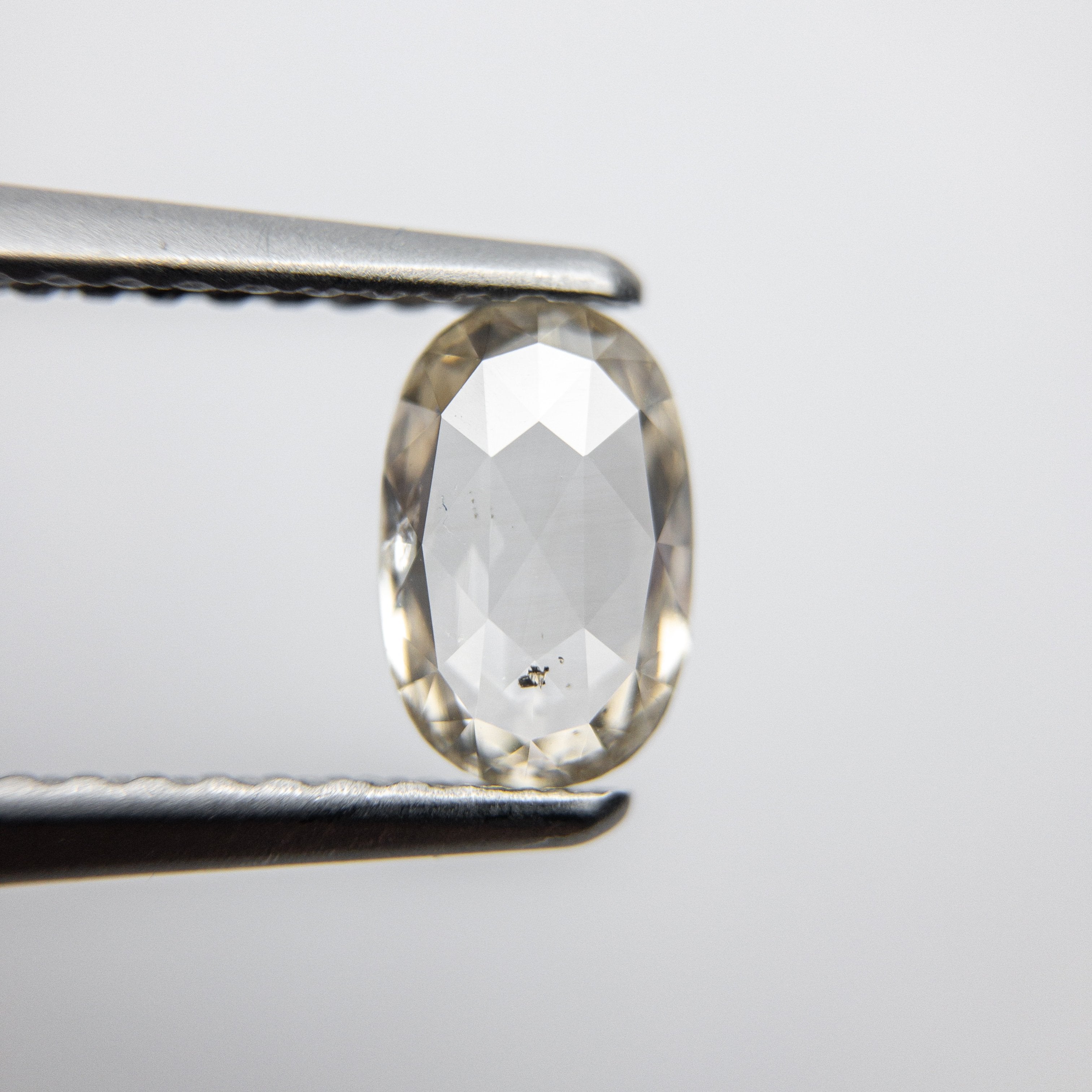 0.70ct 7.08x4.63x2.05mm Oval Rosecut 18090-11 hold d1238