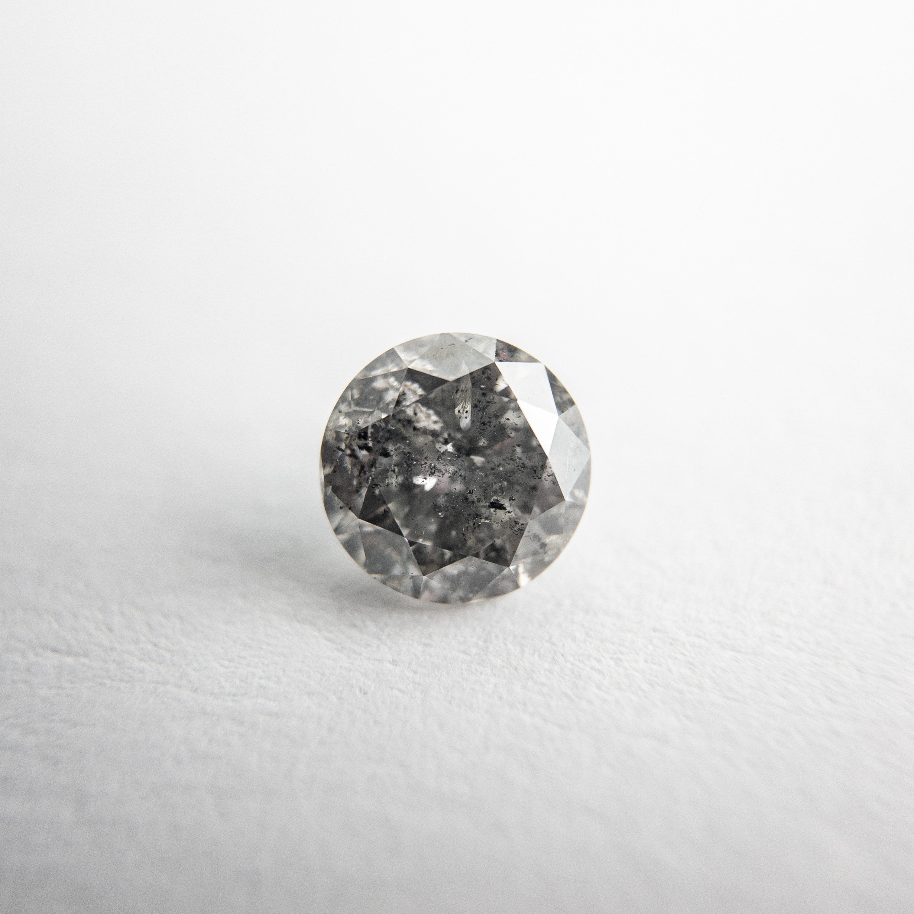 0.68ct 5.54x5.50x3.38mm Round Brilliant 18118-12 hold d928