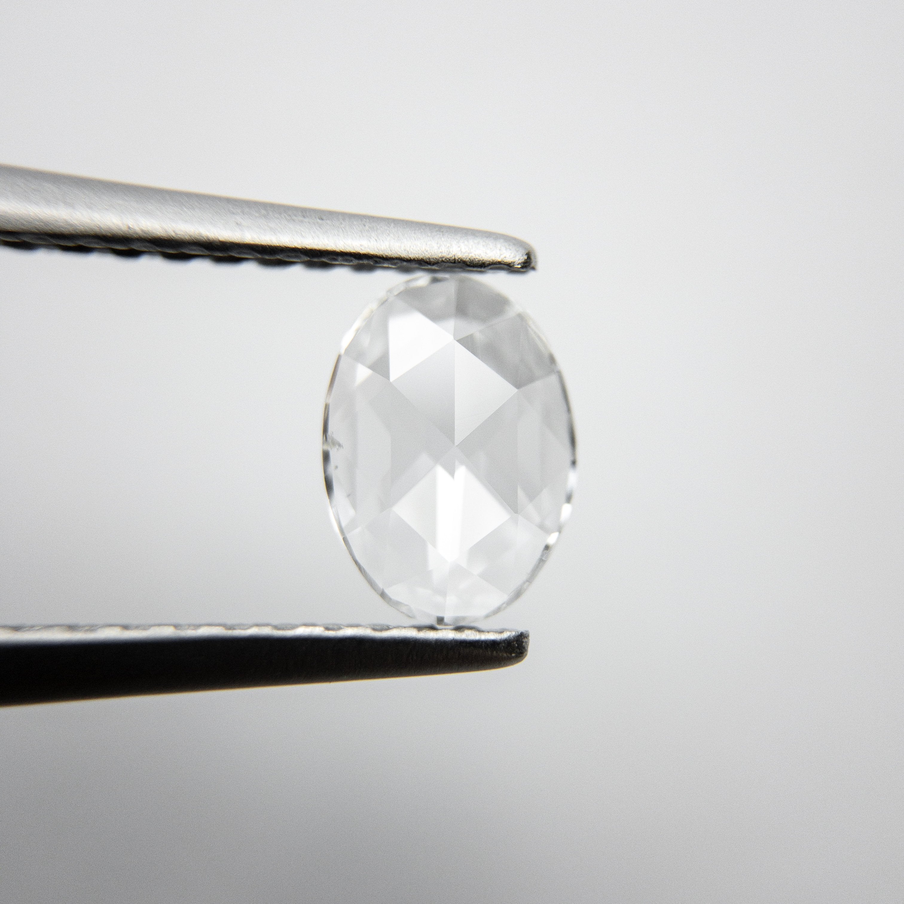 0.37ct 6.87x4.99x1.42mm Oval Rosecut 18237-04 hold D1390