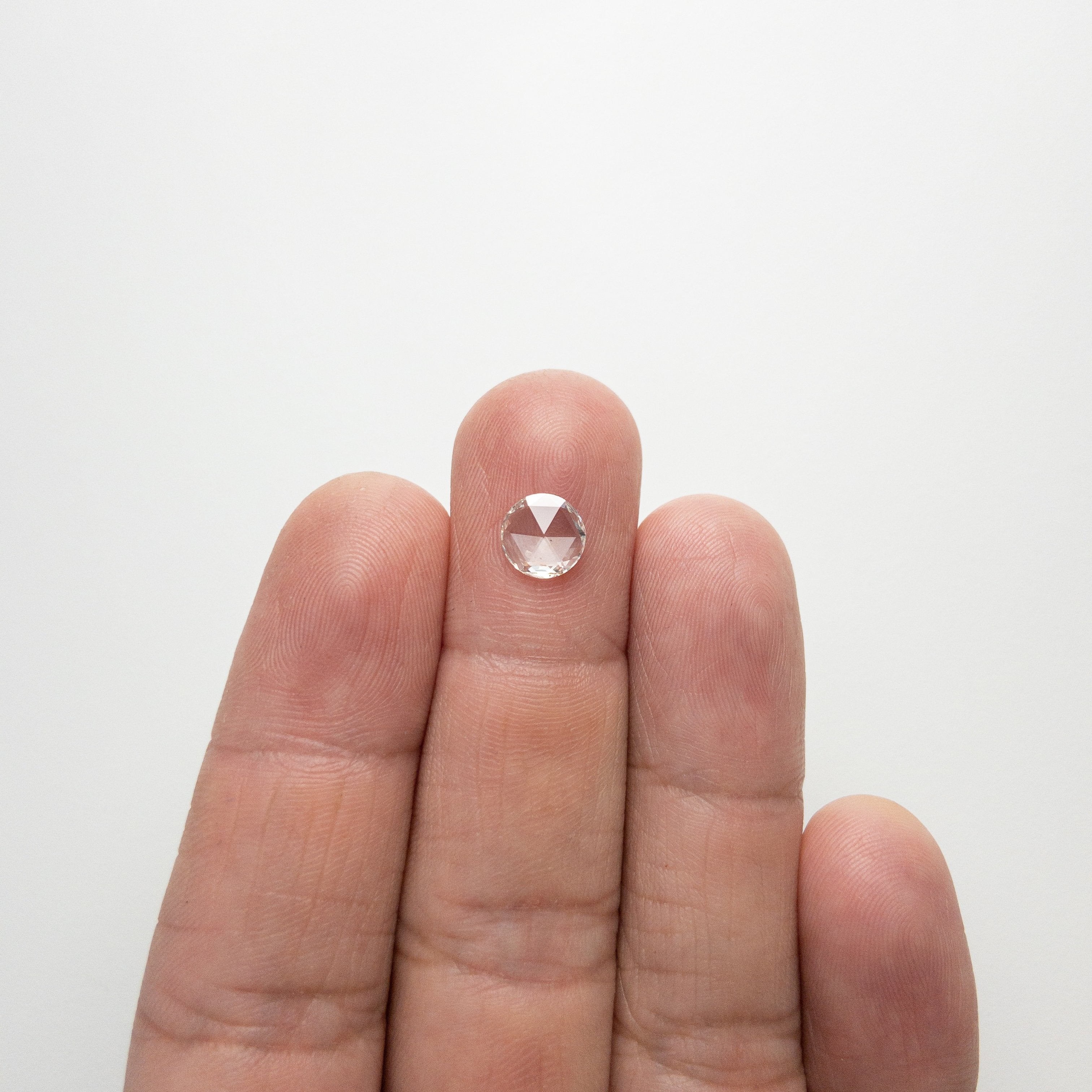 0.66ct 7.25x7.13x1.37mm SI1 H/I Round Rosecut 18284-01 Hold D1955