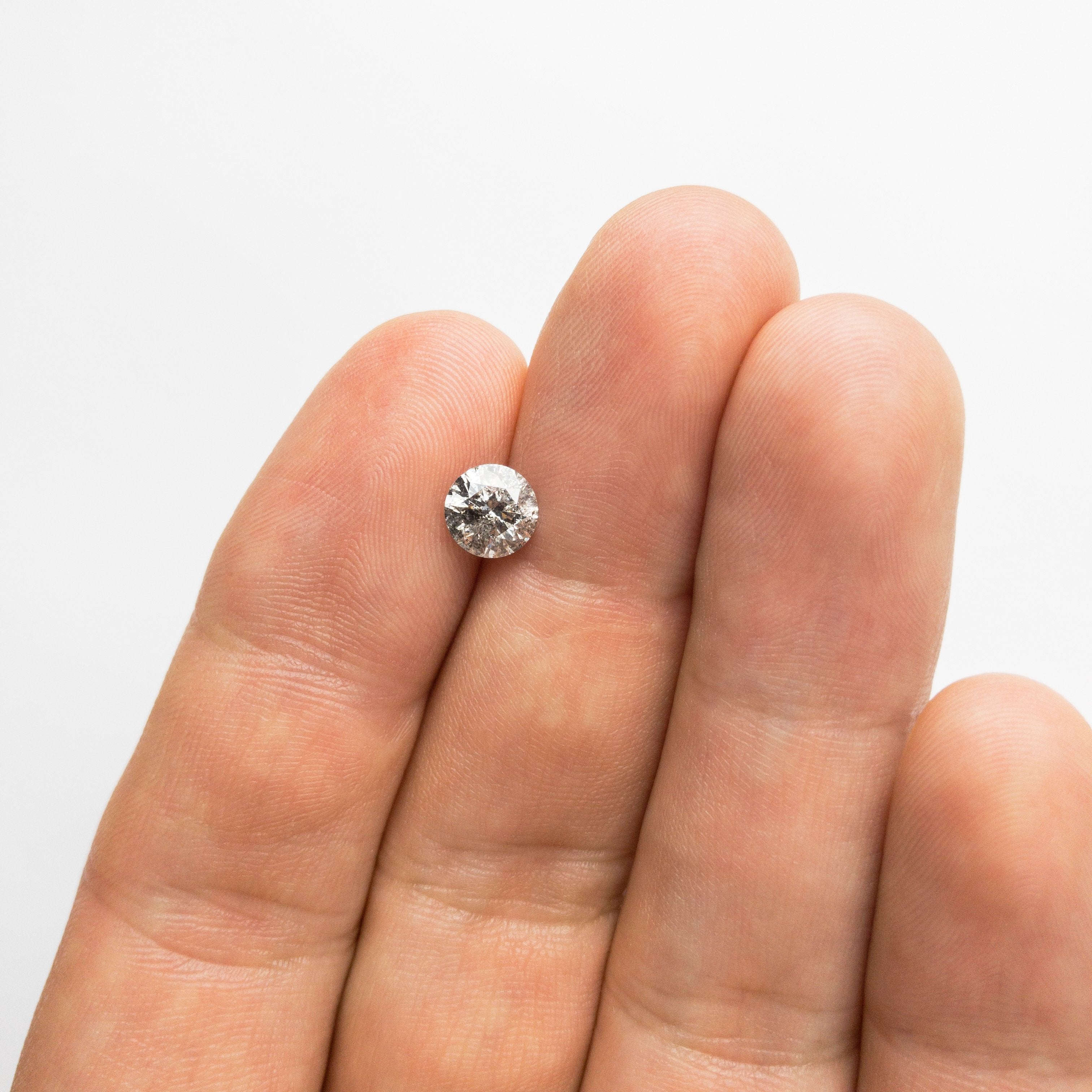 1.15ct 6.56x6.49x4.21mm Round Brilliant 18310-05 hold