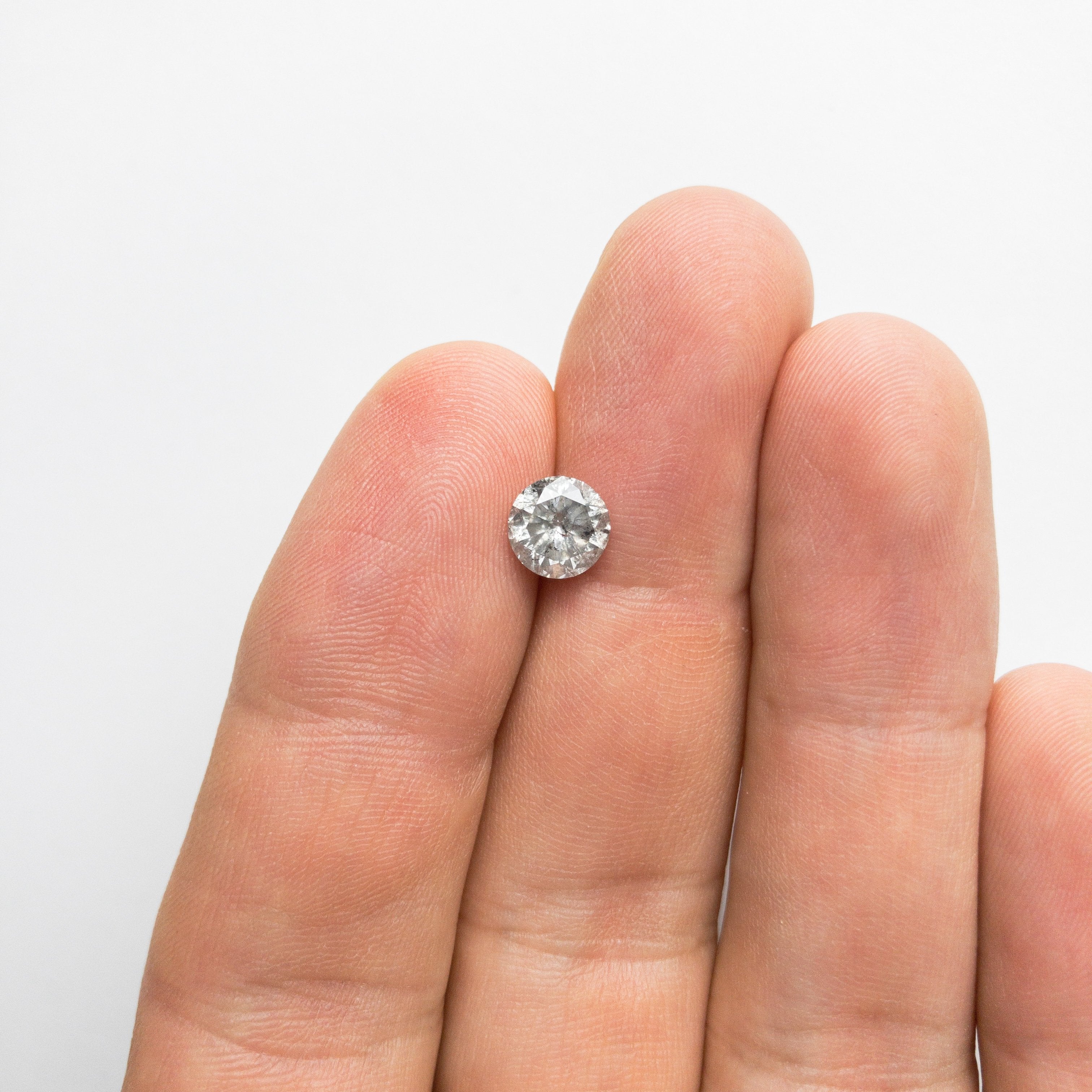 1.28ct 6.93x6.89x4.22mm Round Brilliant 18375-01 hold D1583