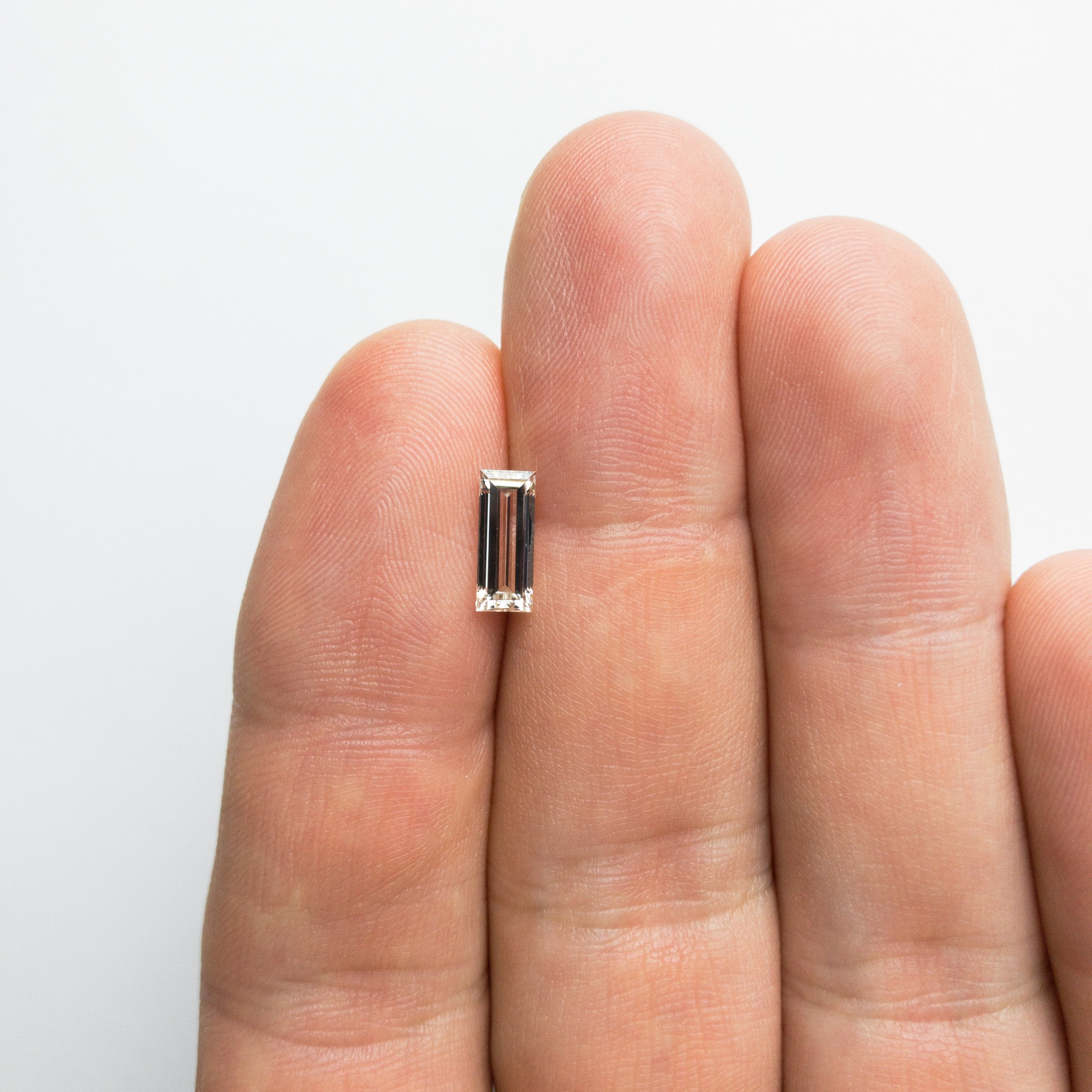 1.01ct 9.40x3.76x2.64mm GIA VS1 K Baguette 18389-01