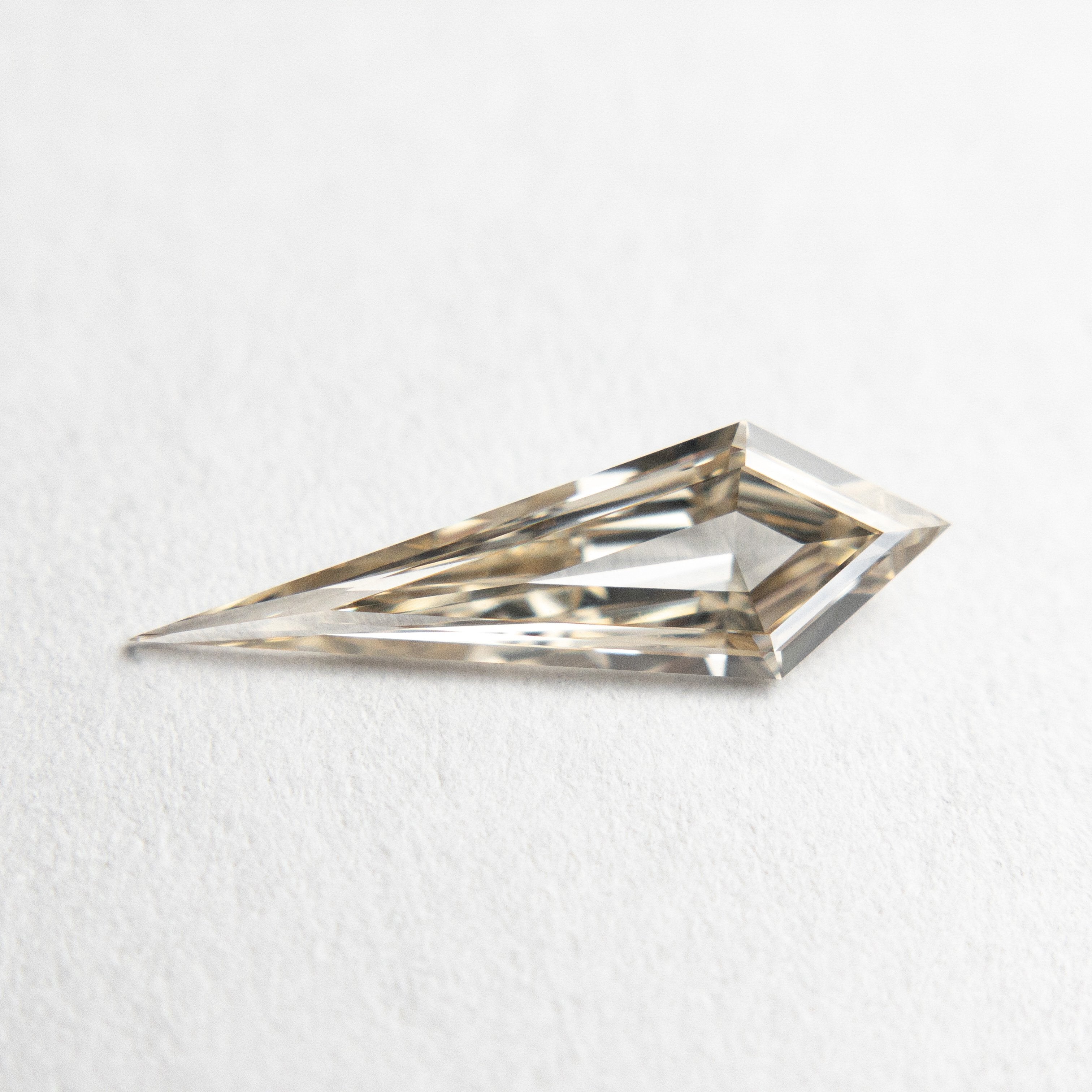 0.58ct 13.83x4.36x1.91mm VS+ Champagne Kite Step Cut 18518-01