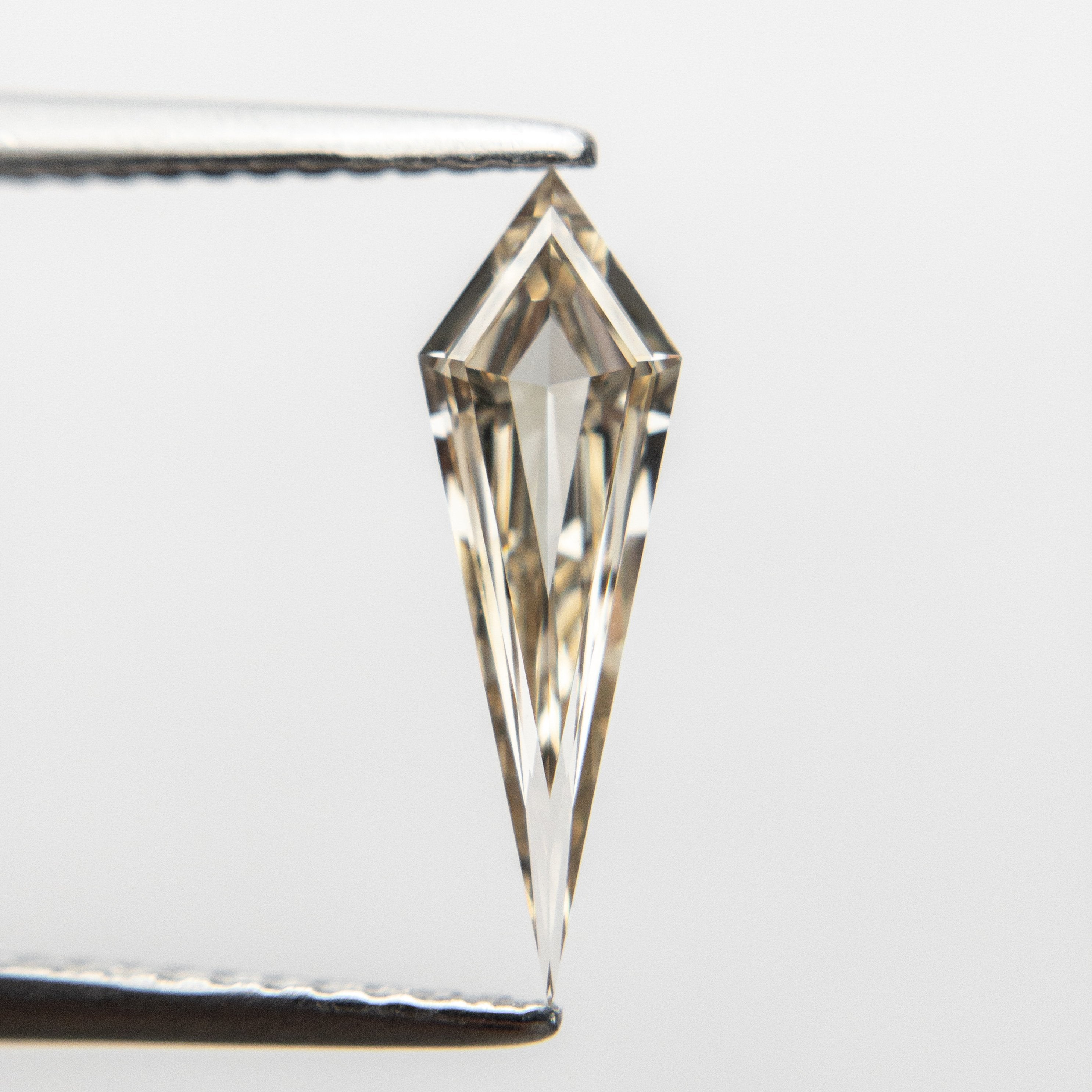 0.58ct 13.83x4.36x1.91mm VS+ Champagne Kite Step Cut 18518-01