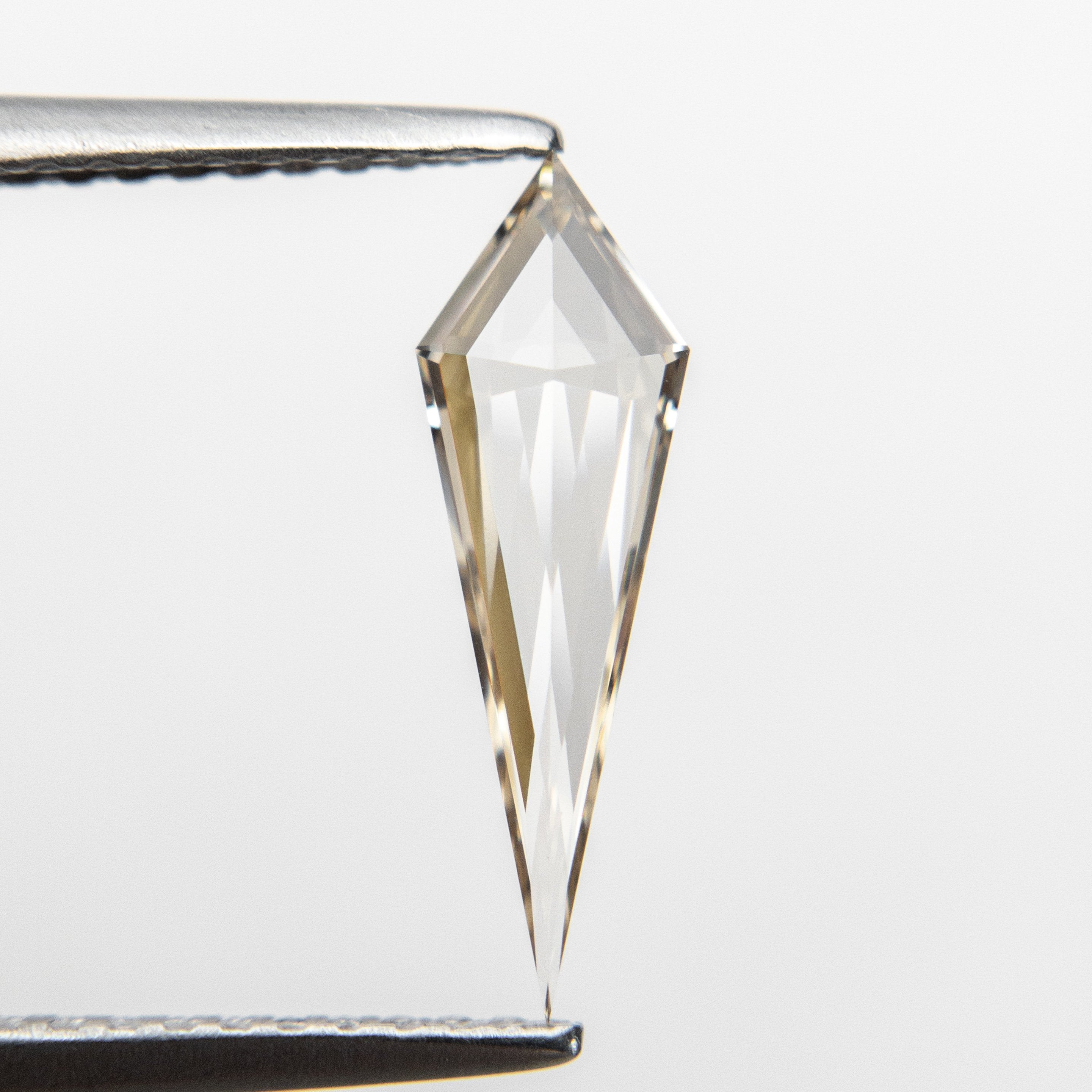 0.58ct 13.83x4.36x1.91mm VS+ Champagne Kite Step Cut 18518-01