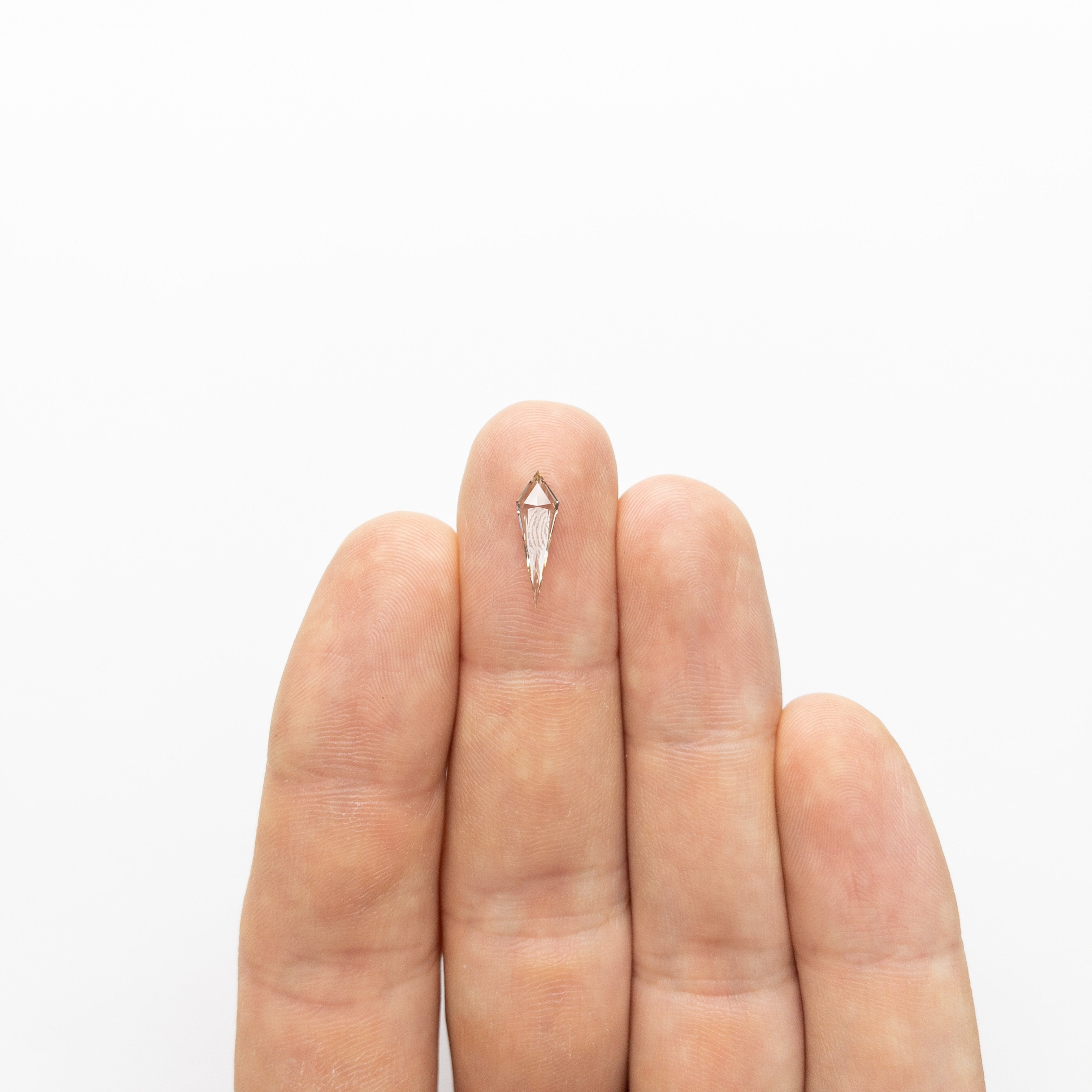 0.58ct 13.83x4.36x1.91mm VS+ Champagne Kite Step Cut 18518-01