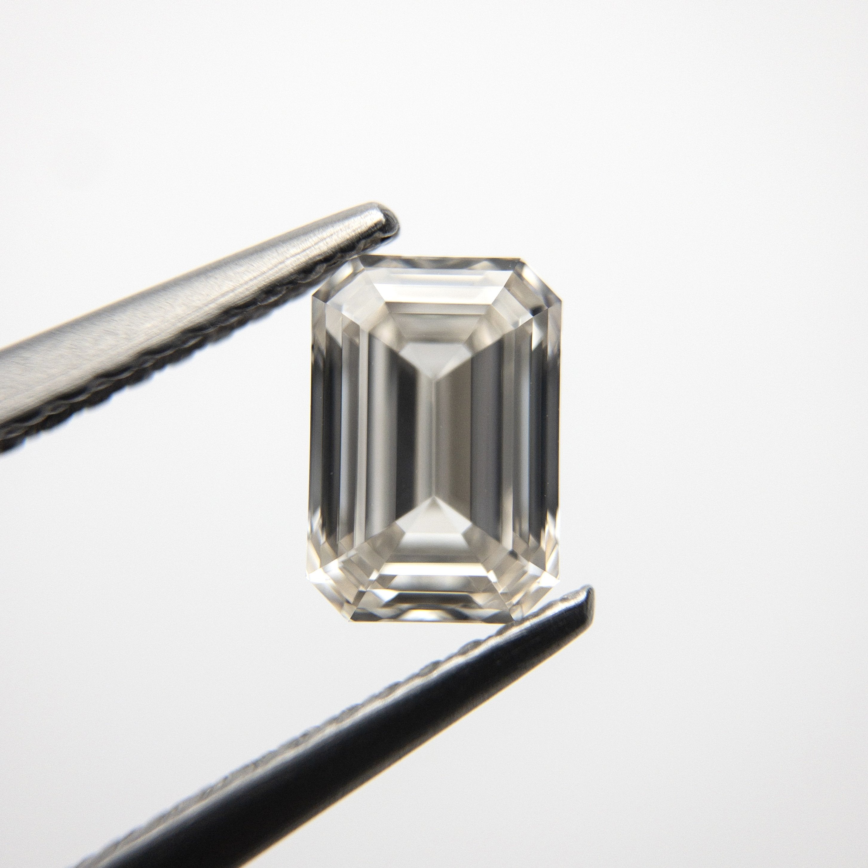 1.06ct 6.94x4.77x3.01mm VS2 Champagne Emerald Step Cut 18535-01
