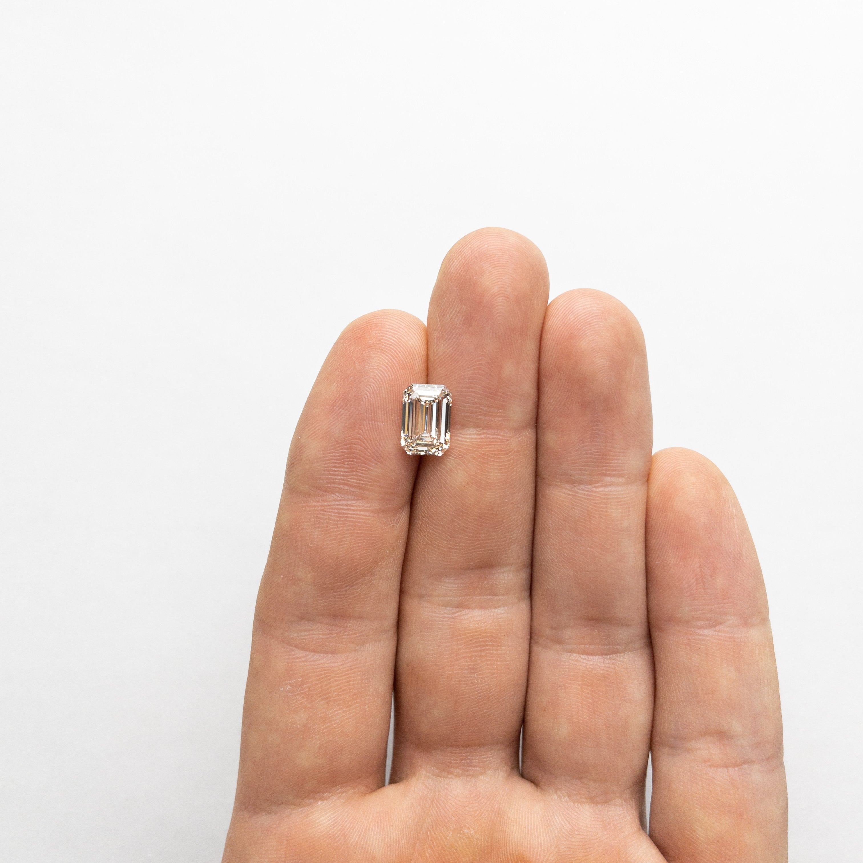 3.01ct 9.92x6.80x4.79mm VS2 O-P Emerald Cut 18622-01