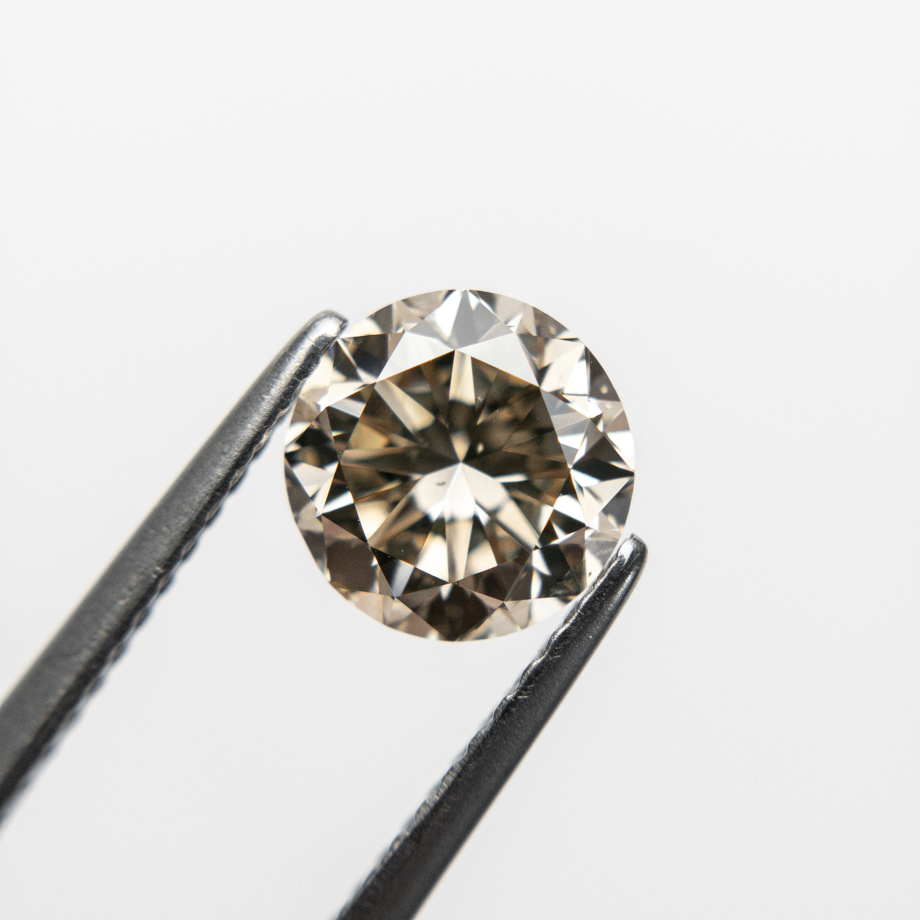 1.51ct 6.94x7.05x4.64mm GIA SI1 Champagne Round Brilliant 18627-01