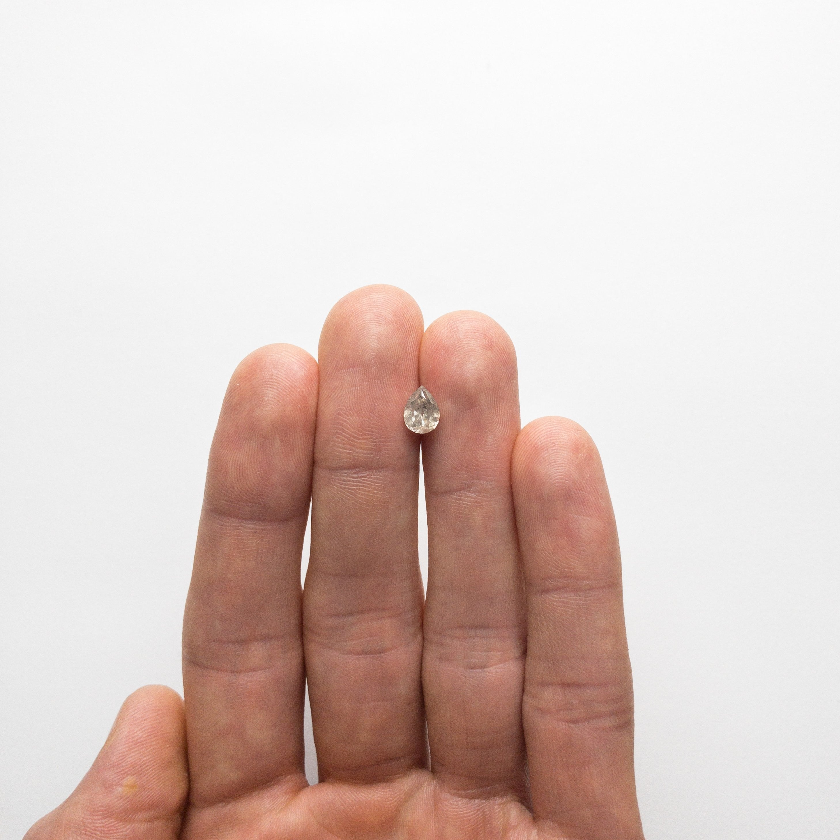 1.07ct 7.47x5.56x3.80mm Salt and Pepper Pear Brilliant 18732-01