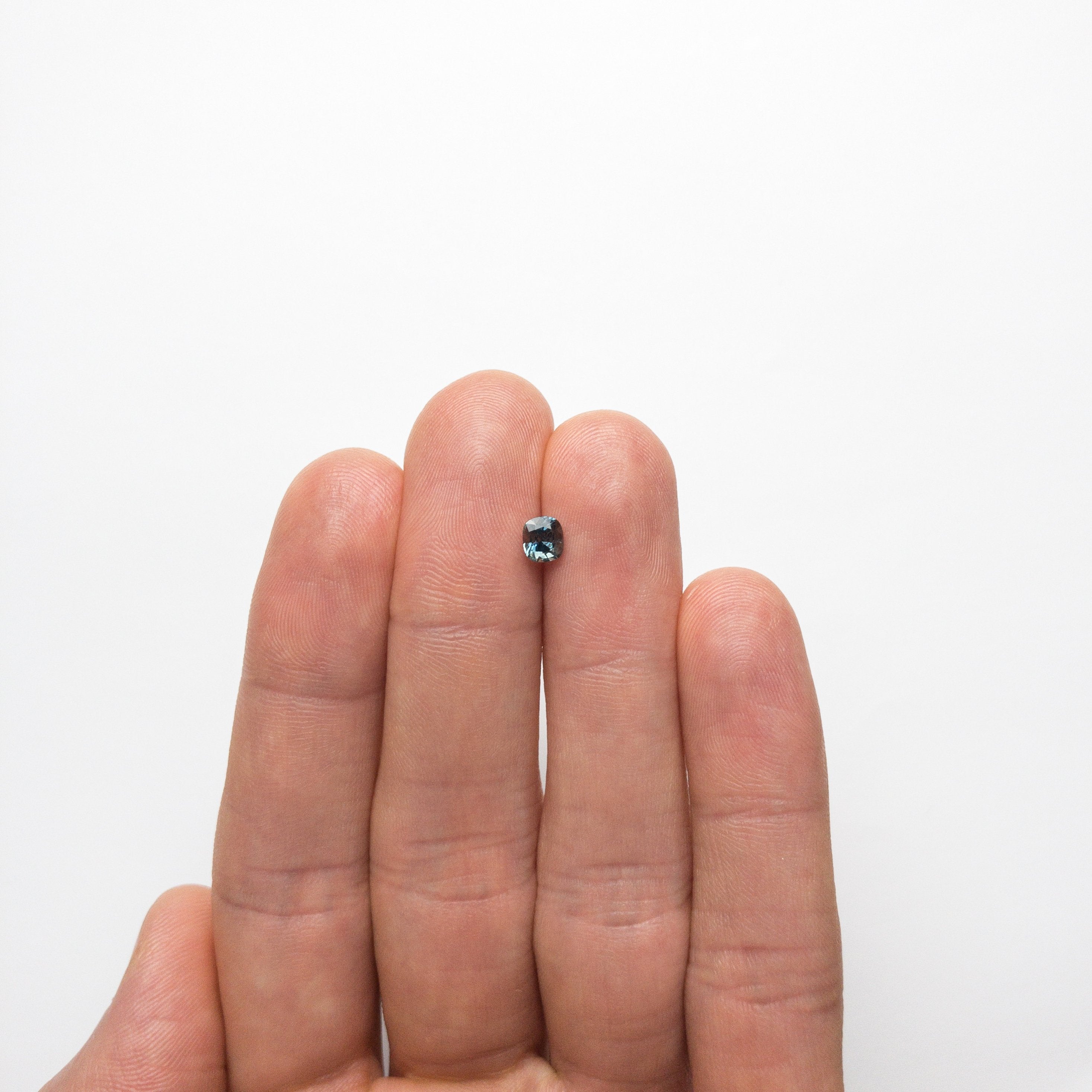 0.64ct 4.93x4.44x3.43mm Cushion Brilliant Sapphire 18973-06