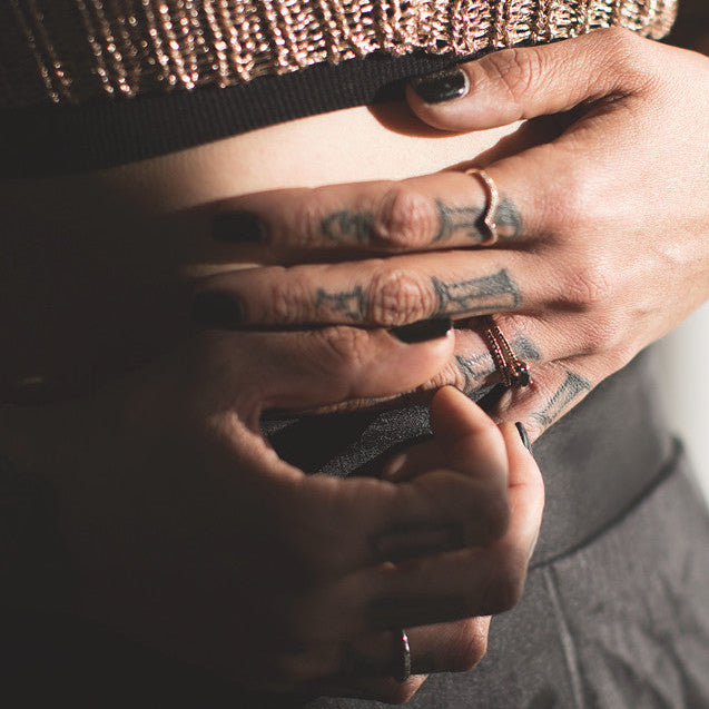 Tattoo hand with wedding bands by Windfall Jewellery