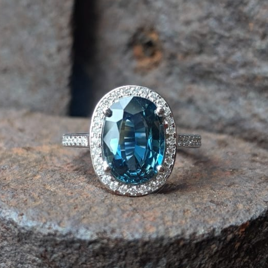 Windfall Jewellery oval halo engagement ring with morganite center stone and sapphirehalo set in white gold — elegant and timeless bridal jewellery.