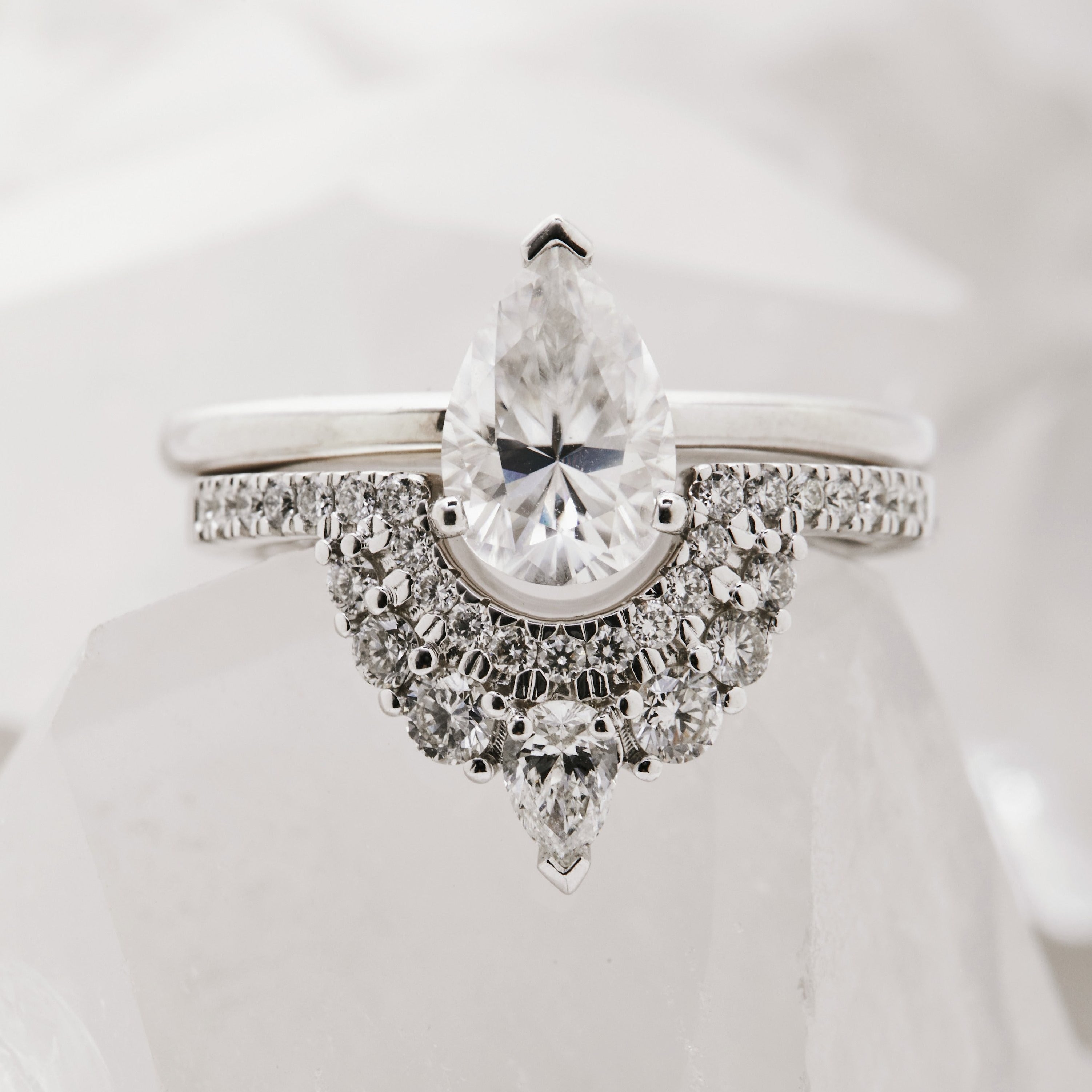 White Gold wedding band doubel row of white diamonds, with pear accent at tip