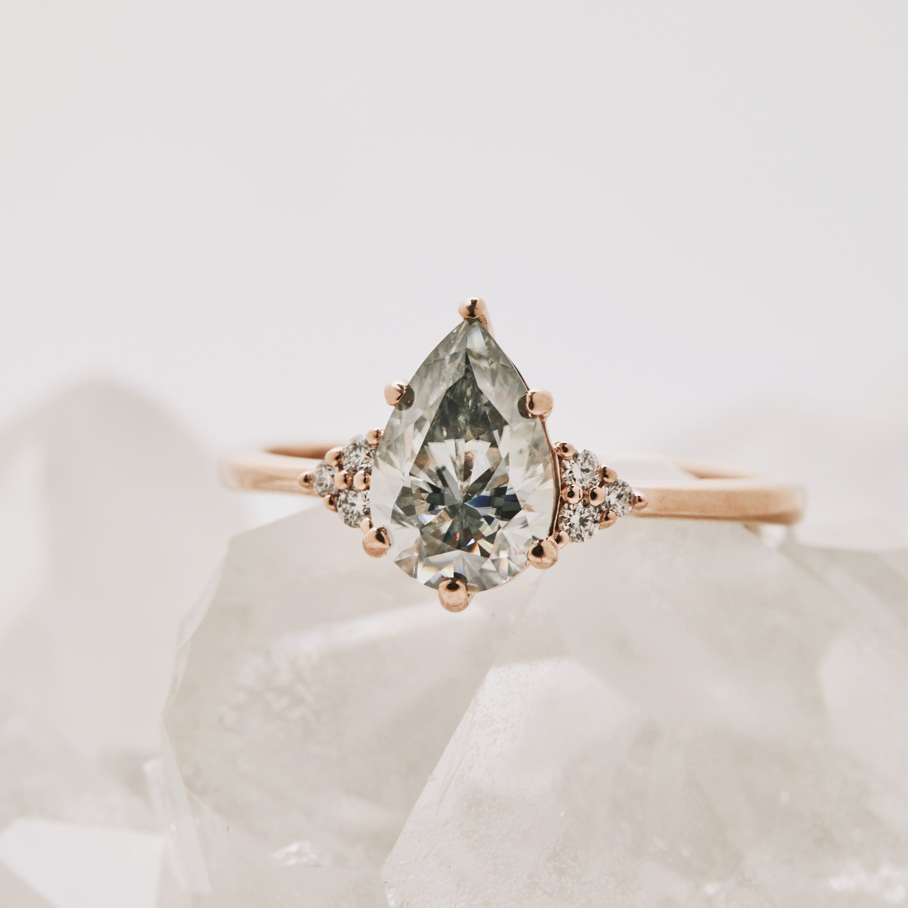 Alternative engagement ring with salt and pepper diamond in pear shape