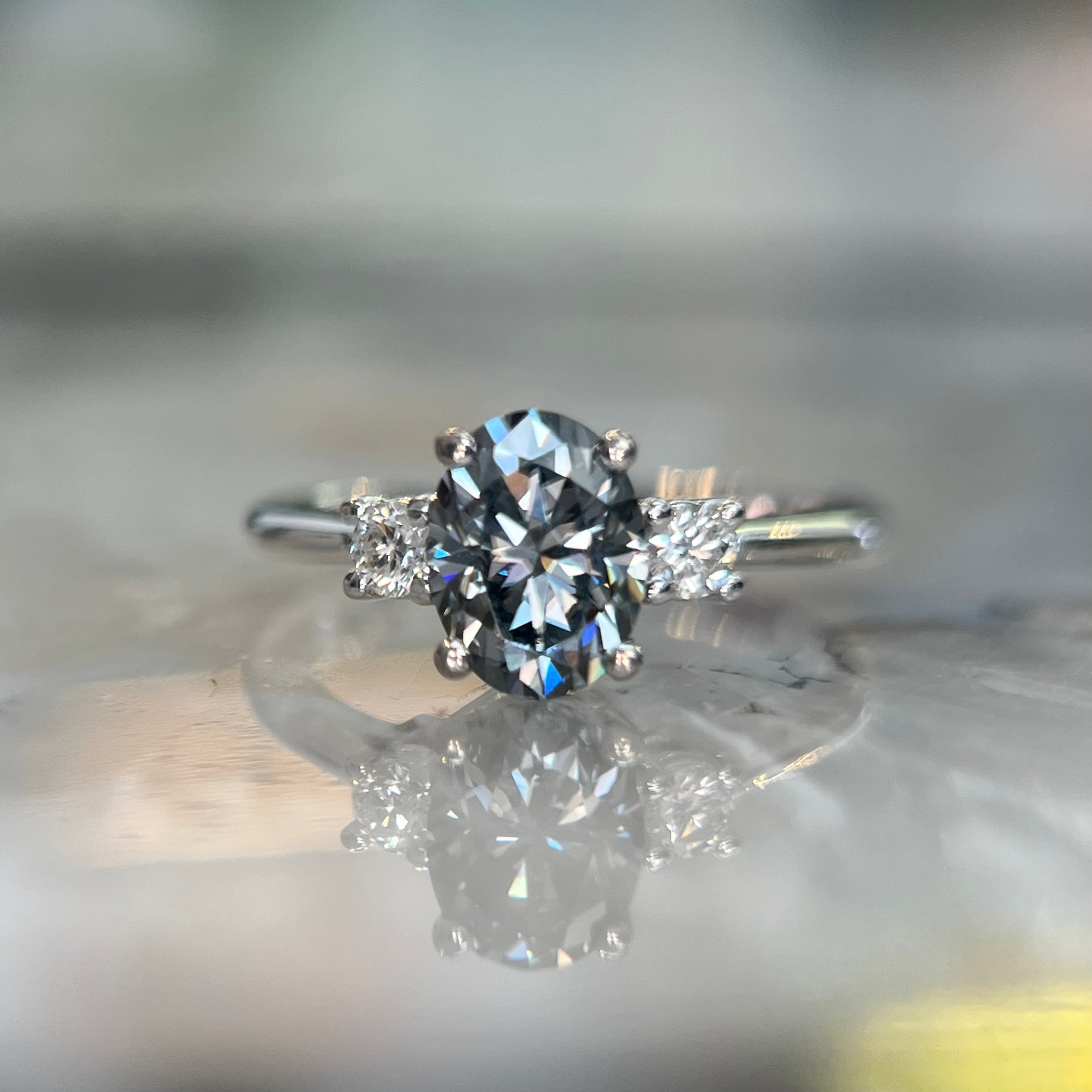 Windfall Jewellery Lotus Oval moissanite engagement ring in rose gold with minimalist three-stone design — handcrafted fine jewellery Australia