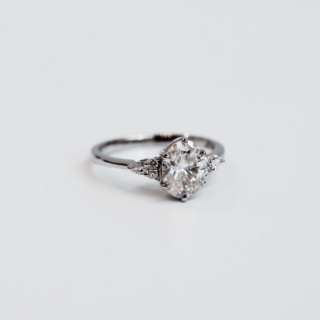 yoki oval lab diamond with pear accents on side white gold