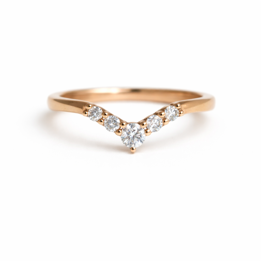 Rose gold ring with five diamonds on a white background
