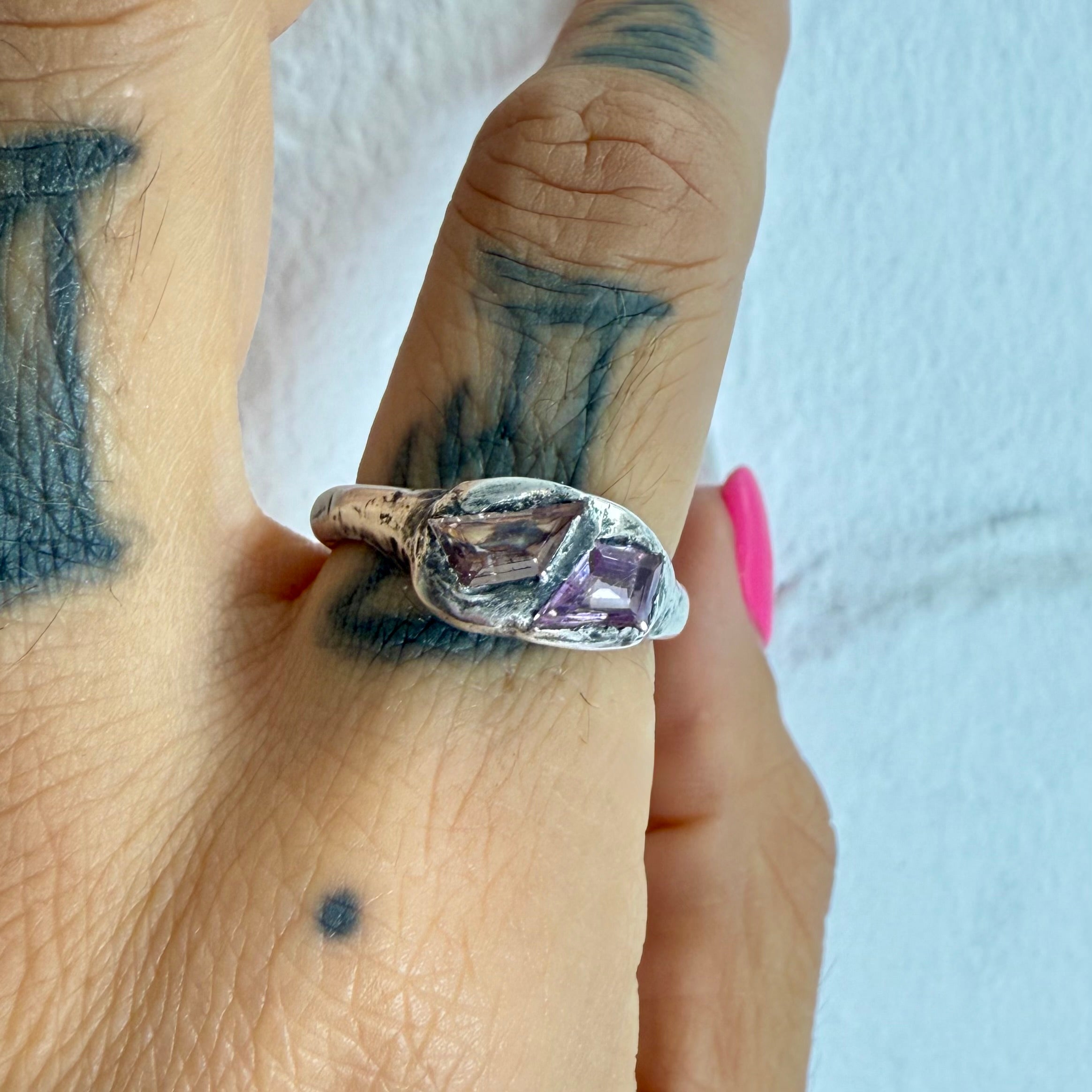 Organic textural raw molten sterling silver ring with kite shaped sapphire