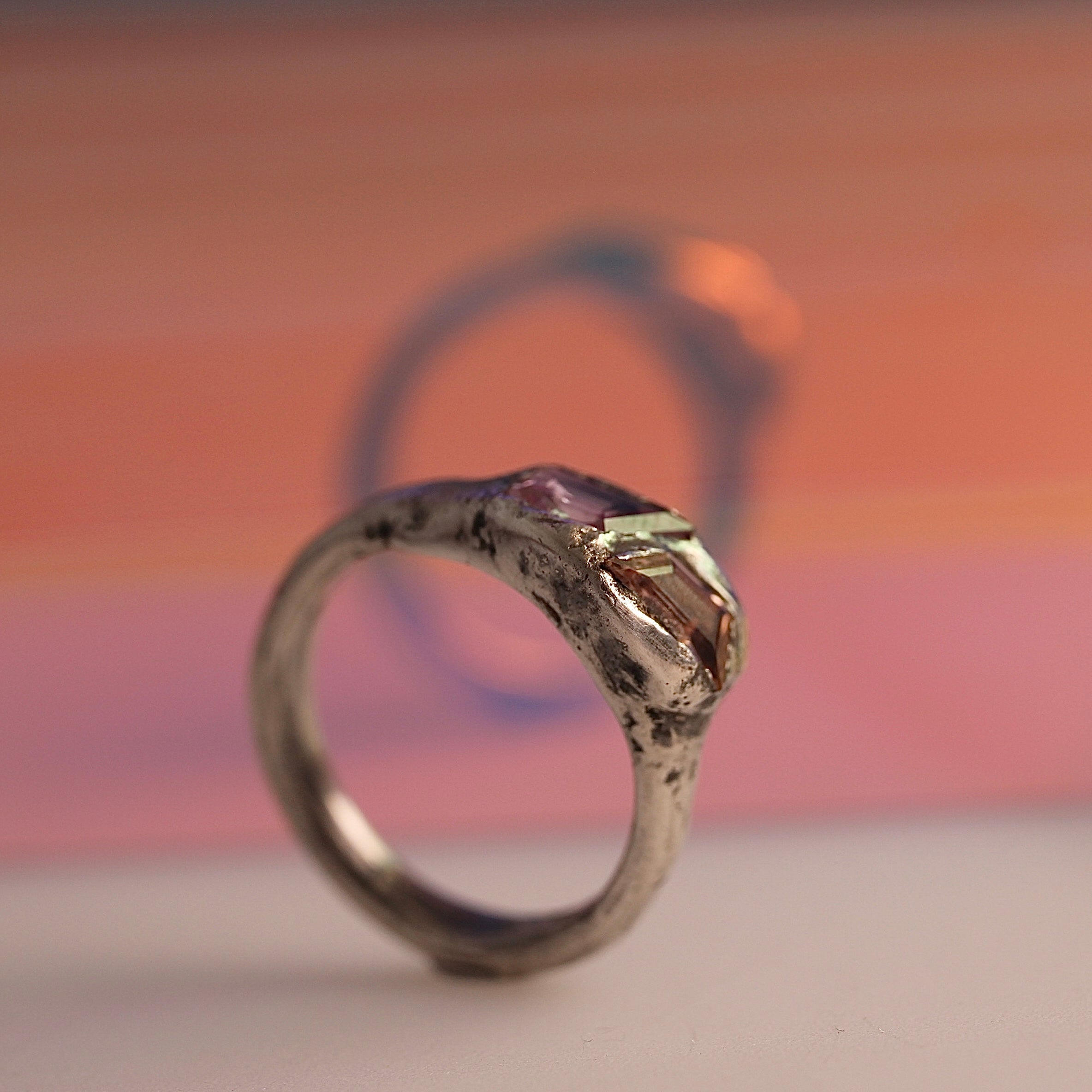 Organic textural raw molten sterling silver ring with kite shaped sapphire