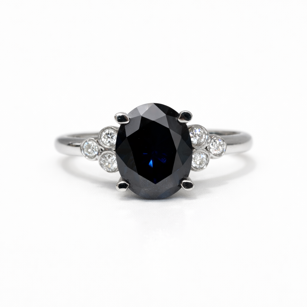 Ring with a black gemstone on a white background
