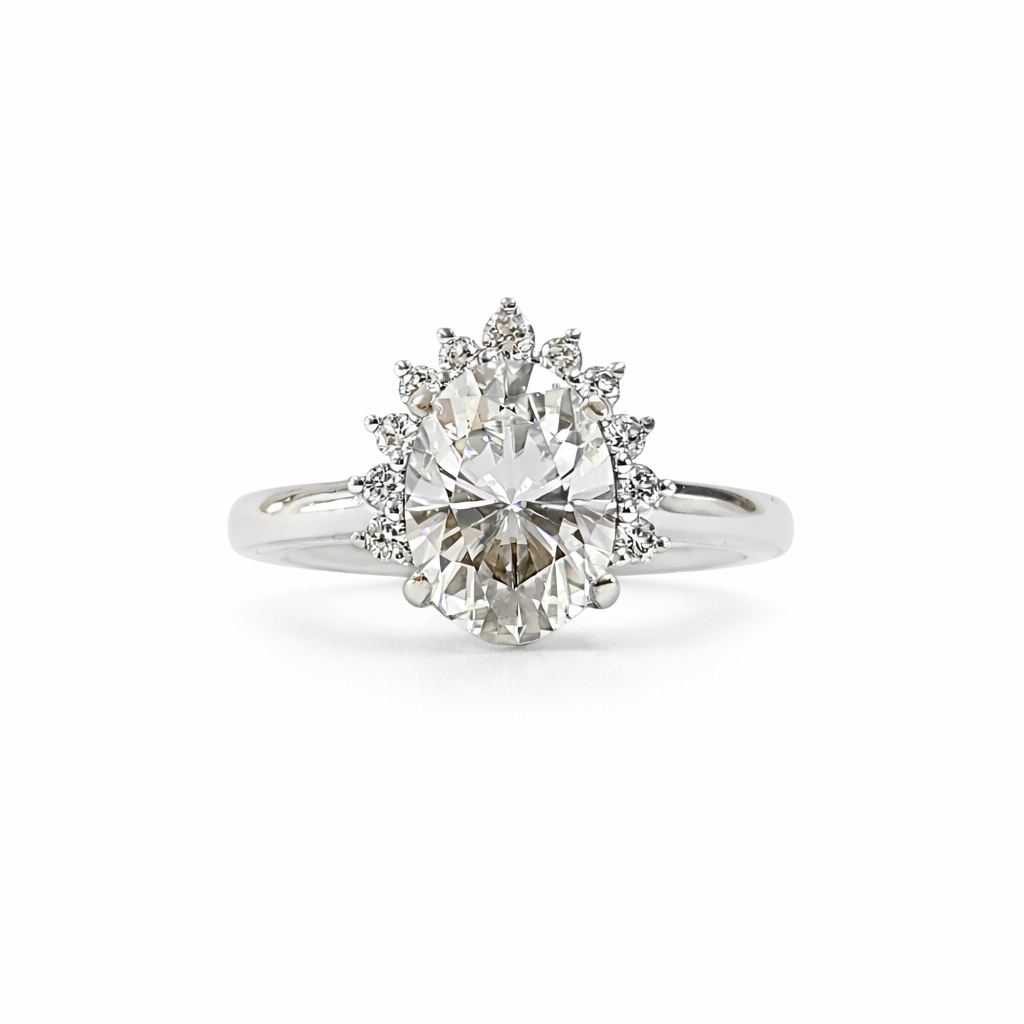 Diamond ring with a starburst design on a white background