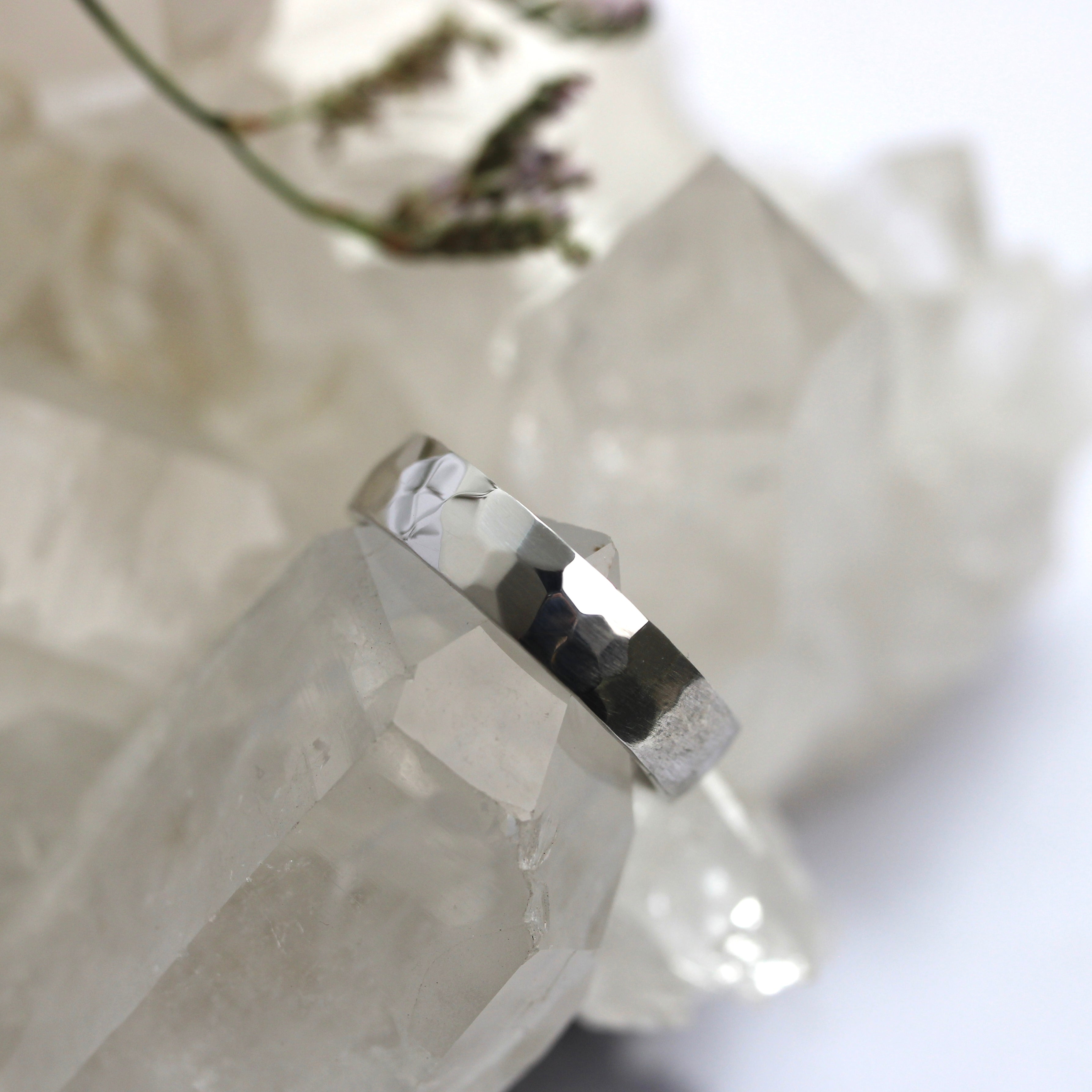 Silver ring on a crystal with a soft background