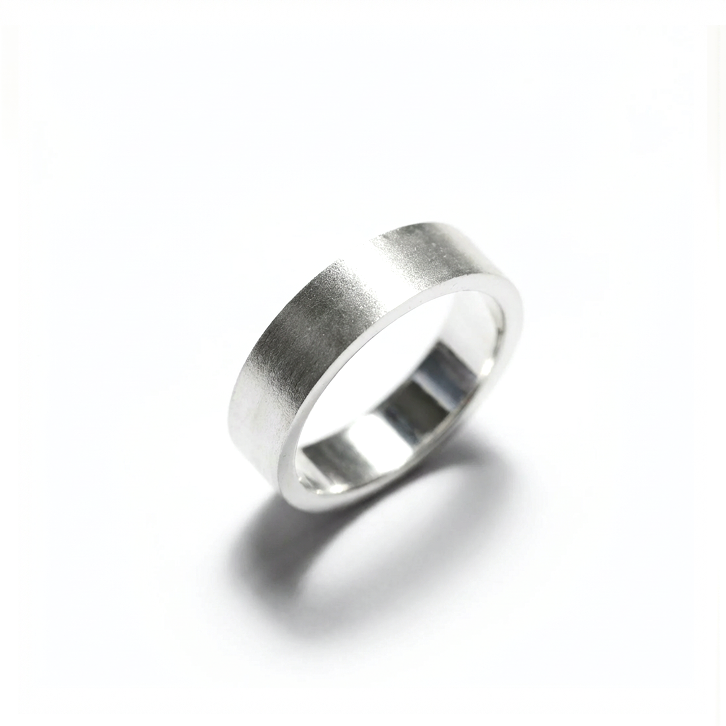 Silver ring on a white background