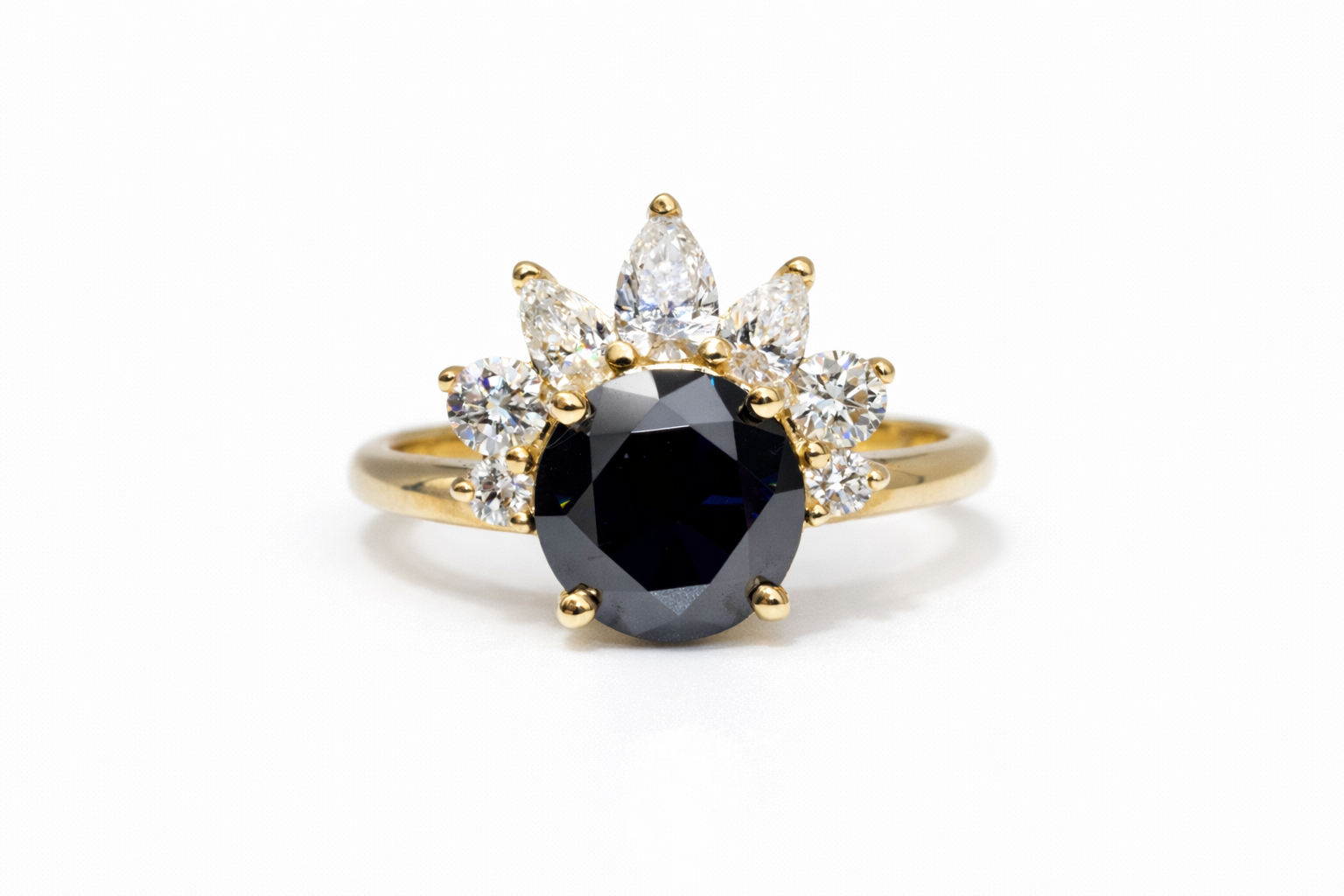 Gold ring with a central black gemstone and smaller diamonds on a white background