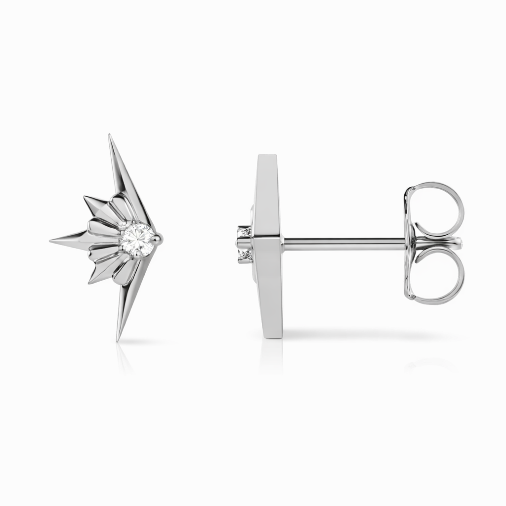 Silver star-shaped earring with a clear gemstone on a white background