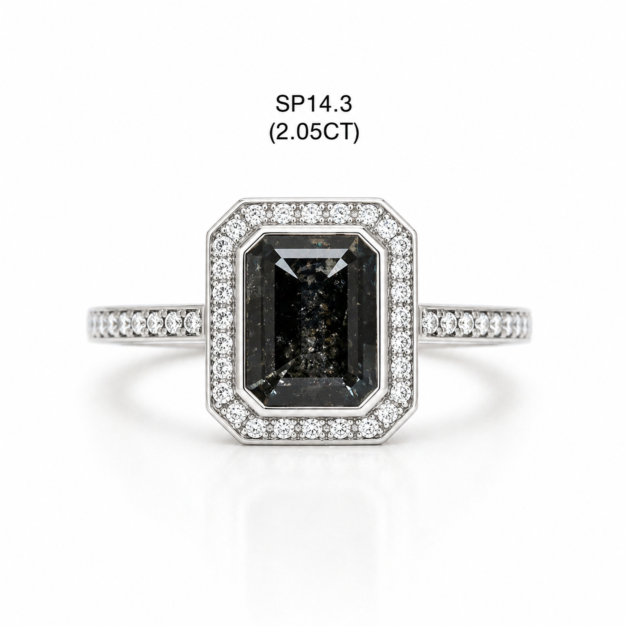 Emerald Cut Shape Diamond ring with a central black gemstone and diamond accents on a white background