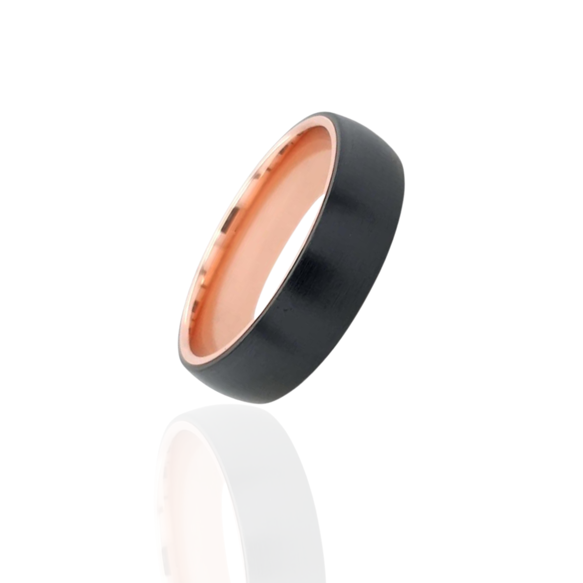 Black and rose gold ring on a white background