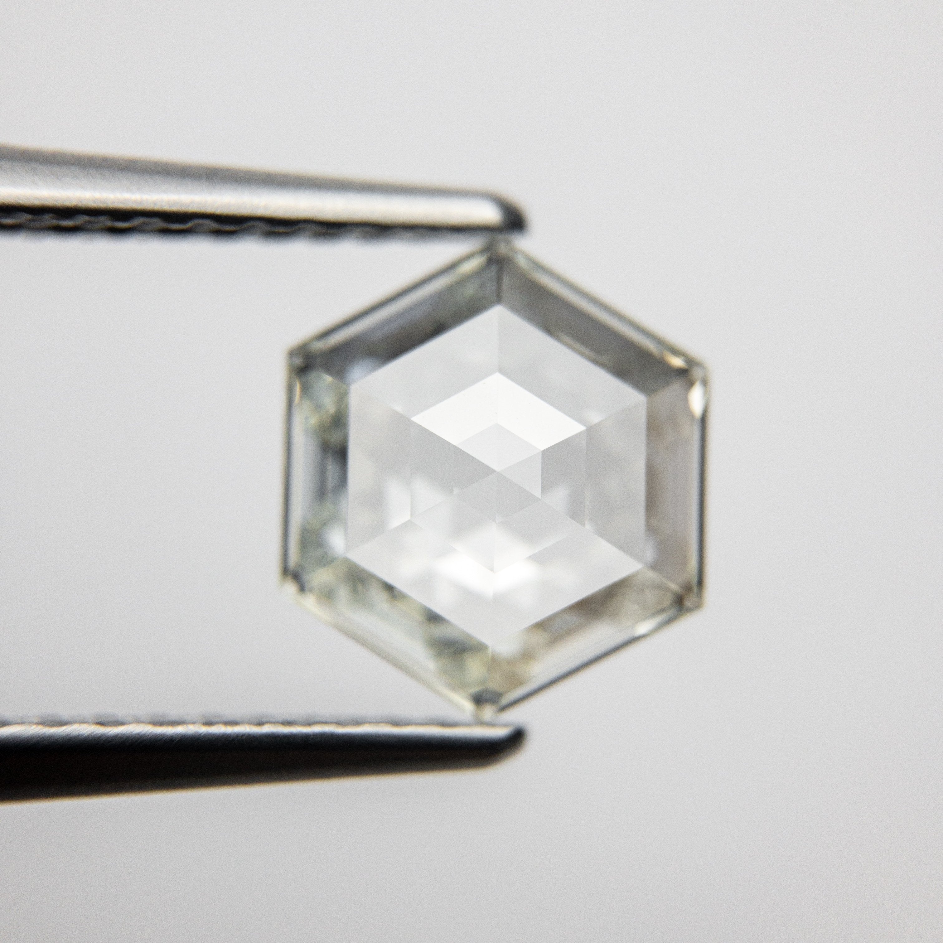 1.51ct 8.59x7.37x3.10mm GIA VVS2 L Hexagon Step Cut 18079-01 hold D1301