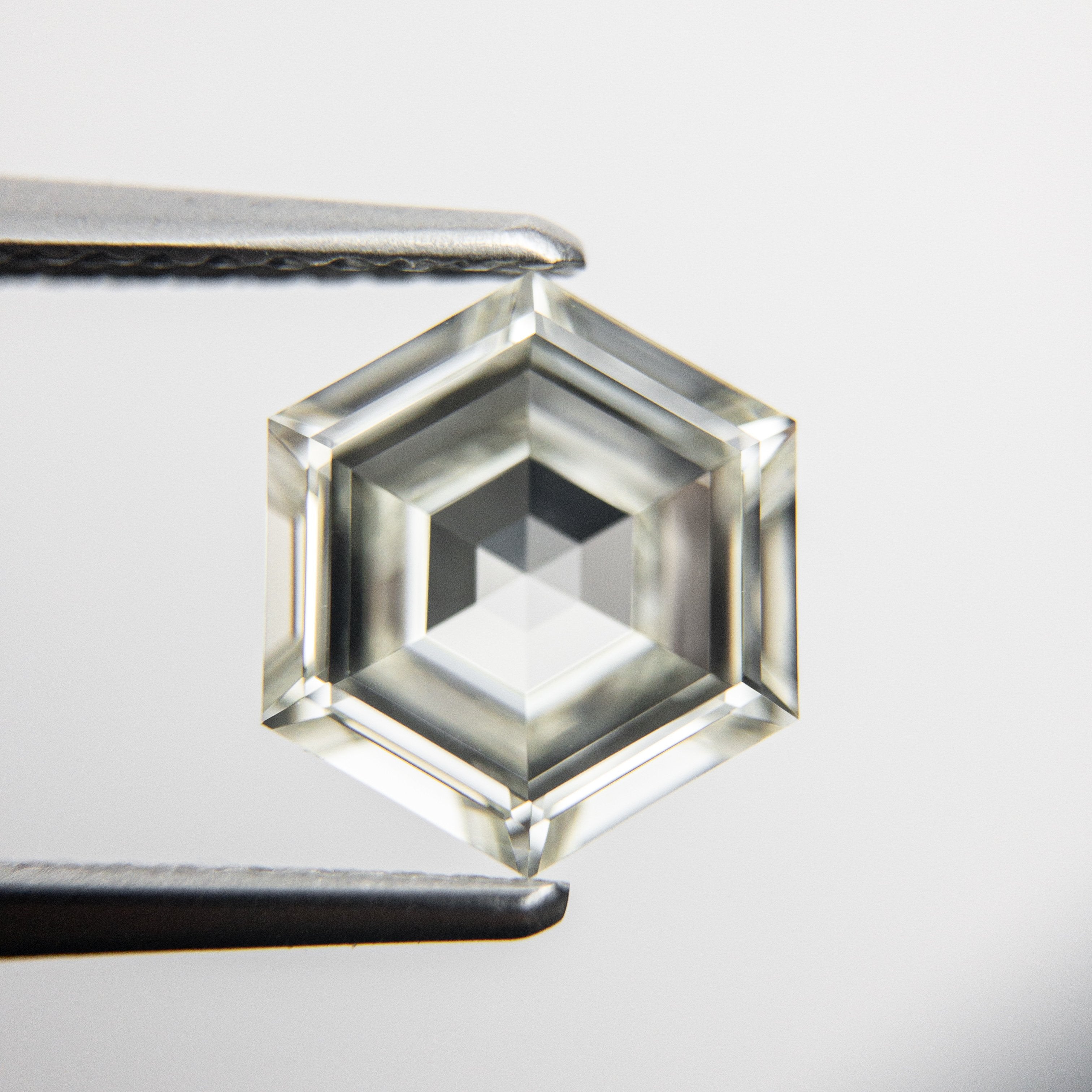 1.51ct 8.59x7.37x3.10mm GIA VVS2 L Hexagon Step Cut 18079-01 hold D1301