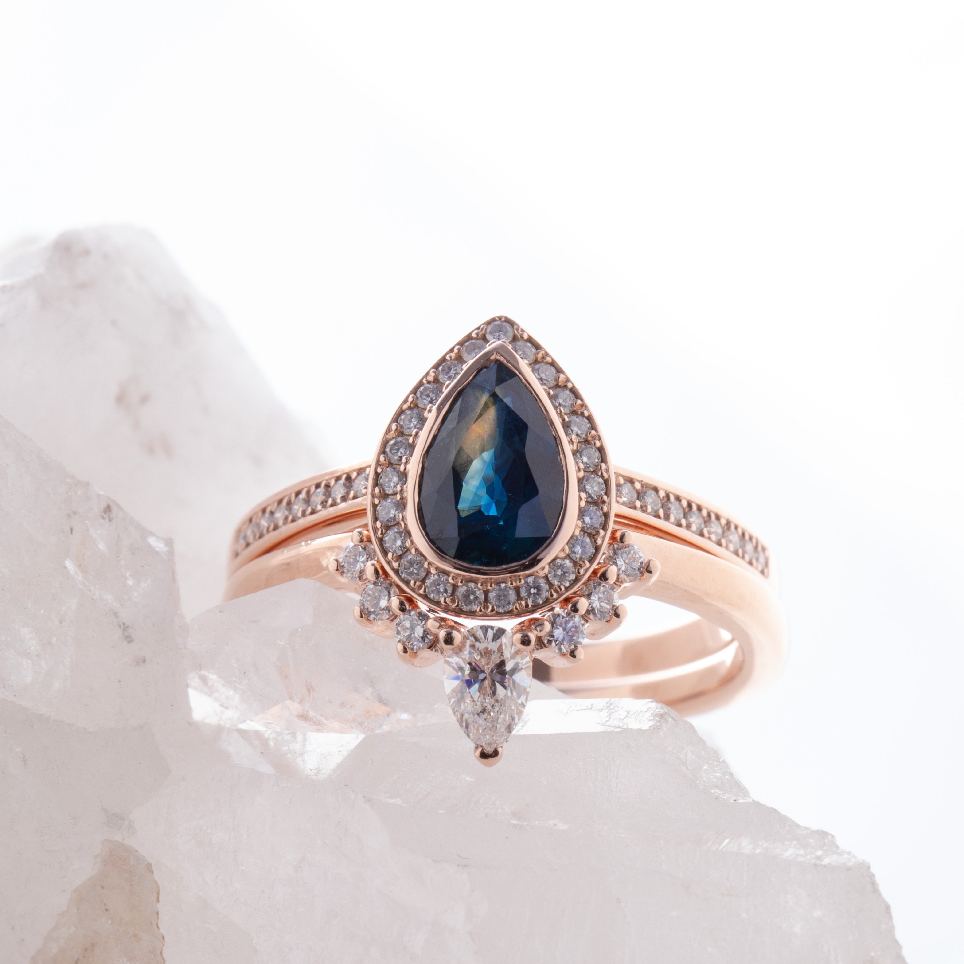 Sid_Stacker._pear_diamond_at_tip_of_tapered_wedding_band