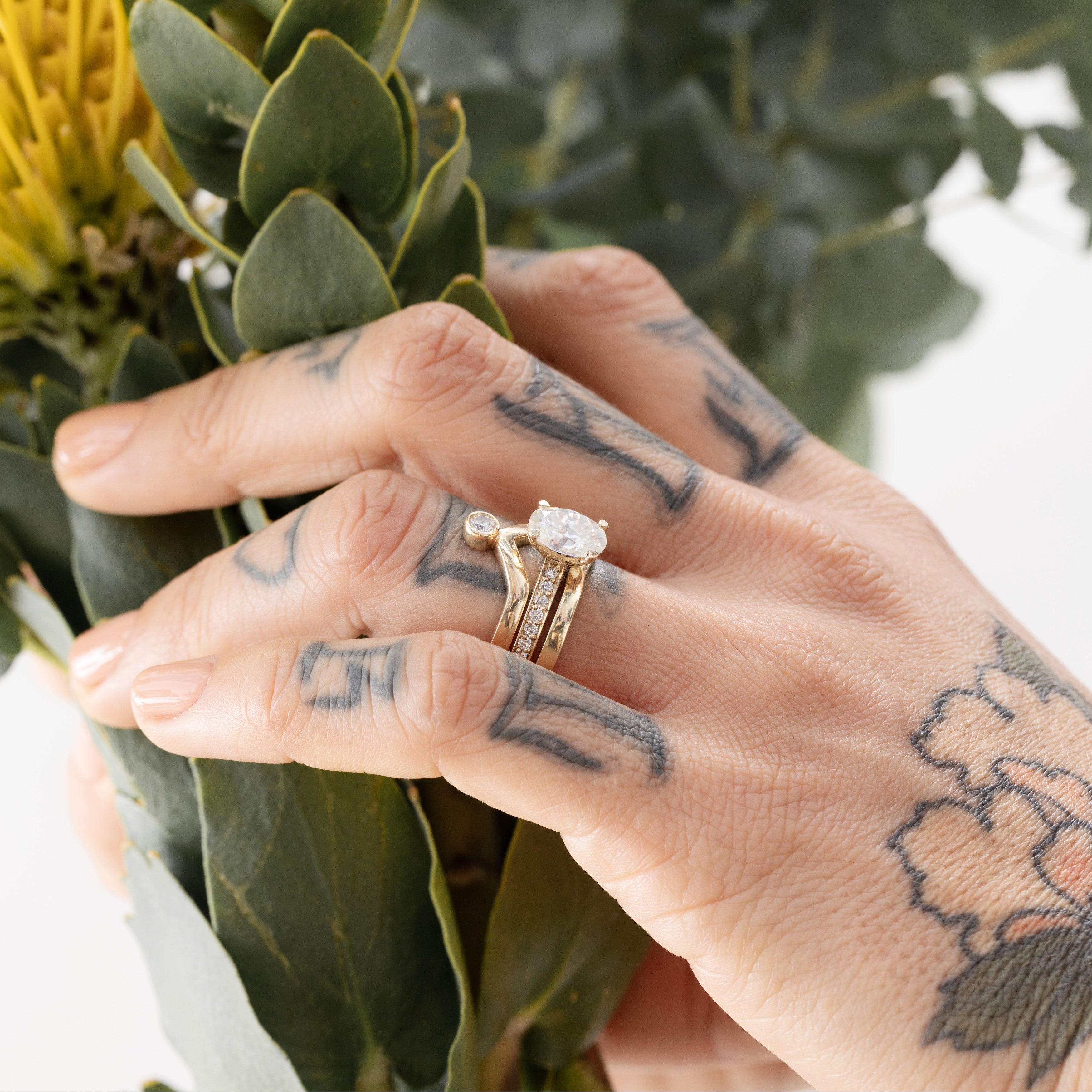 oval shaped solitaire with accented ring band