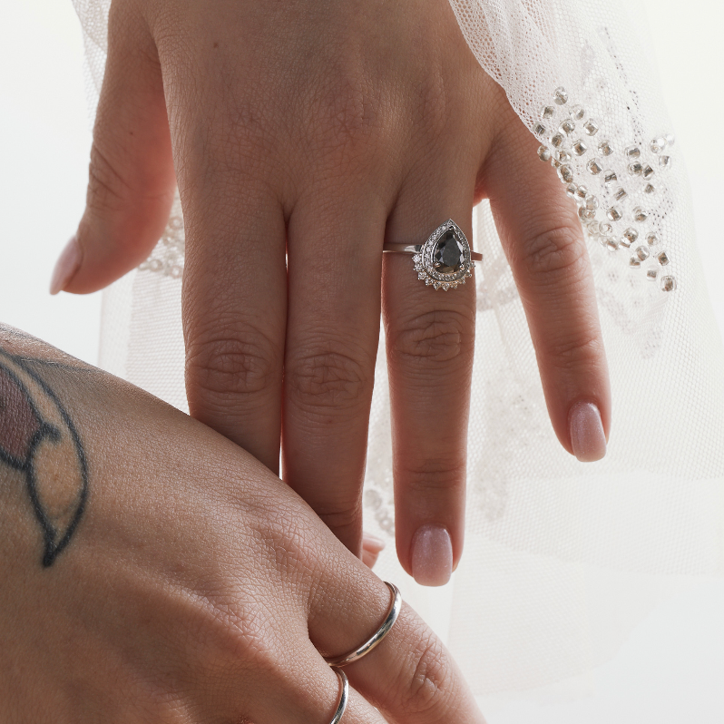 salt and pepper diamond pear shaped engagement ring white gold ob hands