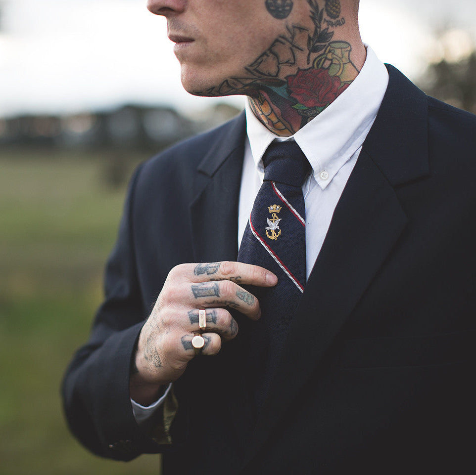 tattooed groom with signet ring
